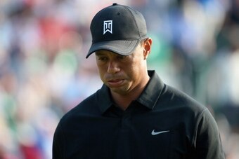 HOYLAKE, ENGLAND - JULY 18:  Tiger Woods of the United States walks off the 18th green during the second round of The 143rd Open Championship at Royal Liverpool on July 18, 2014 in Hoylake, England.  (Photo by Andrew Redington/Getty Images)