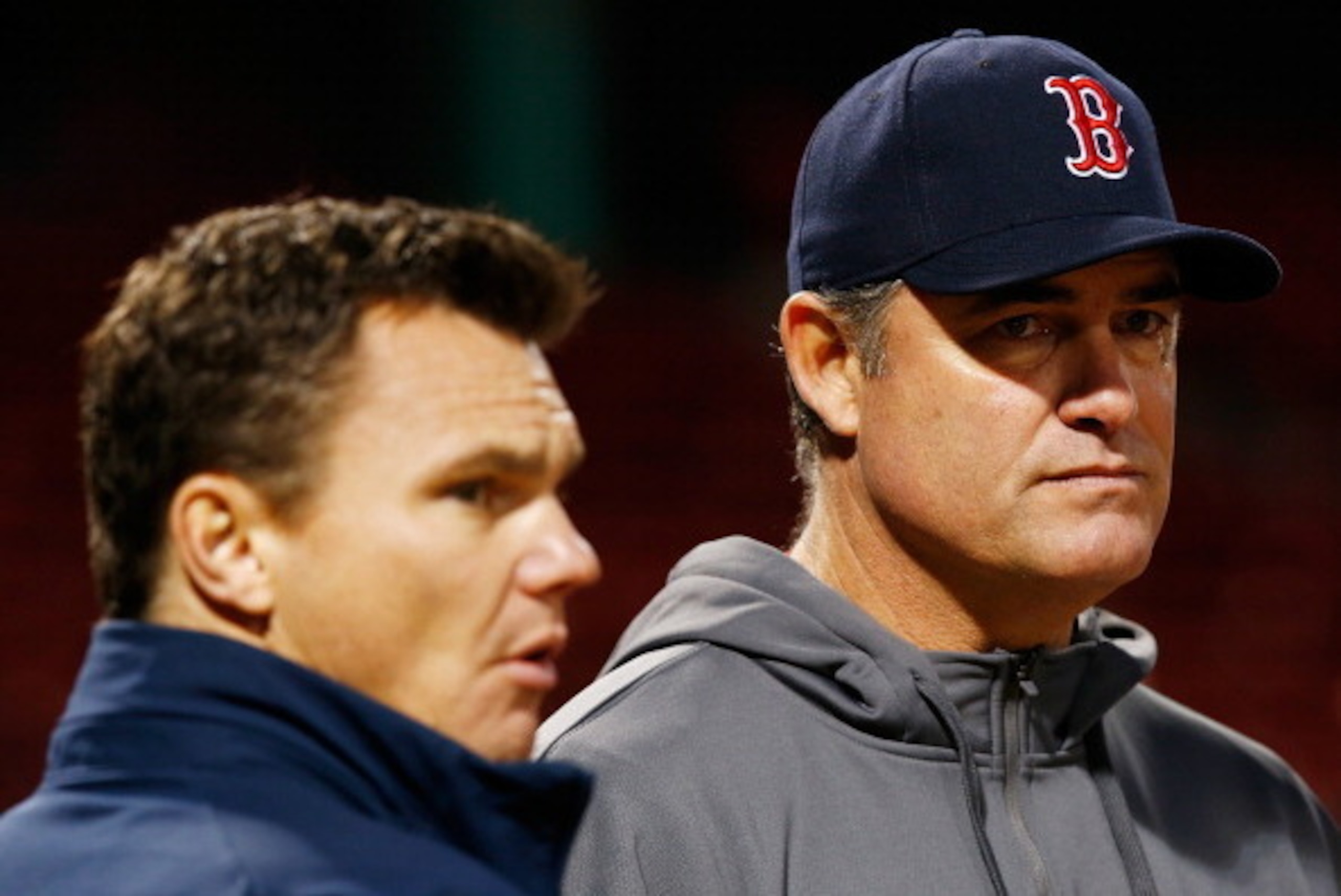BOSTON, MA - OCTOBER 29:  Manager John Farrell #53 of the Boston Red Sox and Executive Vice President and General Manager of the Boston Red Sox, Ben Cherington, watch as the team warms up during the team workout Fenway Park on October 29, 2013 in Boston, 