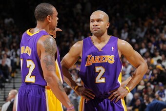 OAKLAND, CA - APRIL 06: Shannon Brown #12 and Derek Fisher #2 of the Los Angeles Lakers discuss the game-plan against the Golden State Warriors on April 6, 2011 at Oracle Arena in Oakland, California. NOTE TO USER: User expressly acknowledges and agrees t