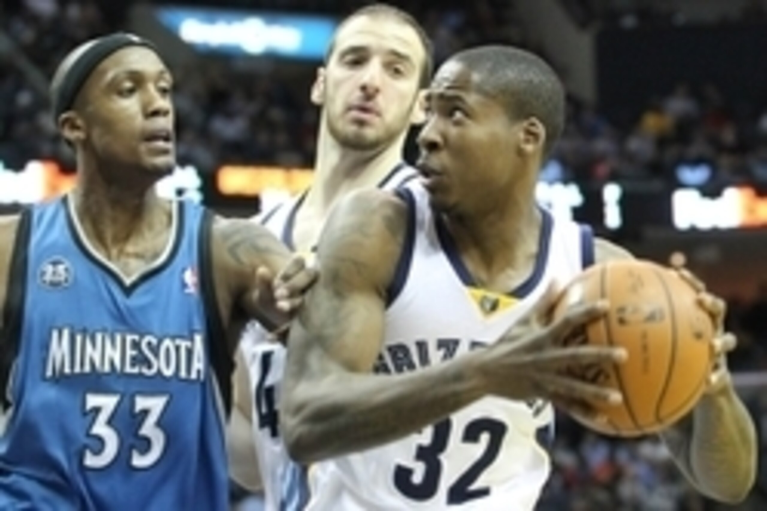 Mar 24, 2014; Memphis, TN, USA; Memphis Grizzlies forward Ed Davis (32) drives against Minnesota Timberwolves forward Dante Cunningham (33) as Grizzlies center Kosta Koufus (41) looks on during the first half at FedExForum. Mandatory Credit: Nelson Chenau