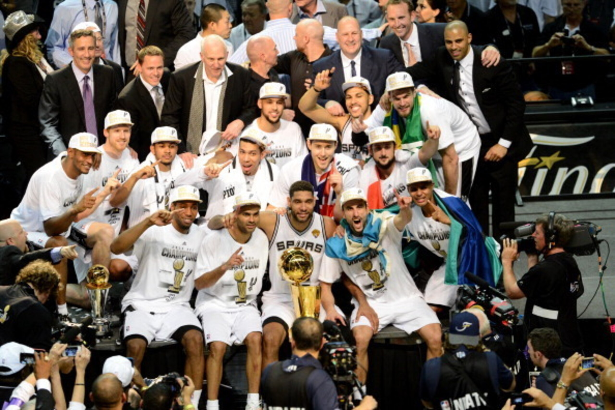 SAN ANTONIO, TX - JUNE 15: Members of the San Antonio Spurs pose for a picture after the win against the Miami Heat during Game Five of the 2014 NBA Finals between the Miami Heat and San Antonio Spurs at AT&T Center on June 15, 2014 in San Antonio, Texas SAN ANTONIO, TX - JUNE 15: Members of the San Antonio Spurs pose for a picture after the win against the Miami Heat during Game Five of the 2014 NBA Finals between the Miami Heat and San Antonio Spurs at AT&T Center on June 15, 2014 in San Antonio, Texas