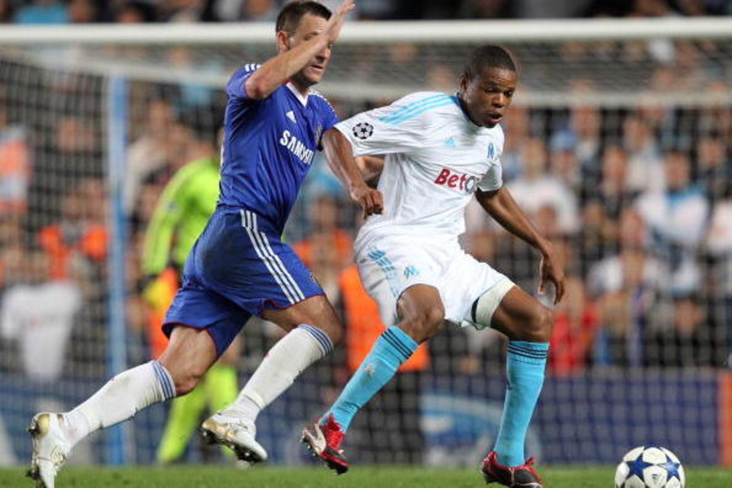 LONDON, ENGLAND - SEPTEMBER 28 :   Loic Remy of Marseille shields the ball from John Terry, Captain of Chelsea during the UEFA Champions League Group F match between Chelsea and Marseille at Stamford Bridge on September 28, 2010 in London, England.  (Phot