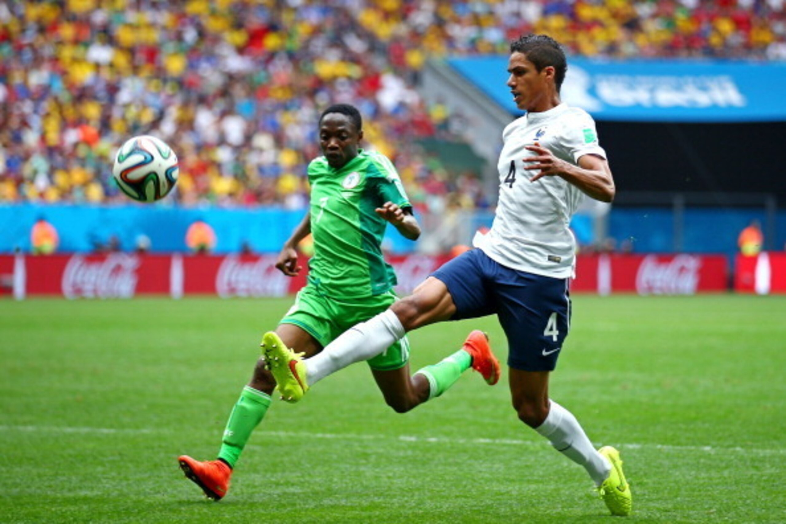 BRASILIA, BRAZIL - JUNE 30: Raphael Varane of France controls the ball against Ahmed Musa of Nigeria during the 2014 FIFA World Cup Brazil Round of 16 match between France and Nigeria at Estadio Nacional on June 30, 2014 in Brasilia, Brazil.  (Photo by Pa