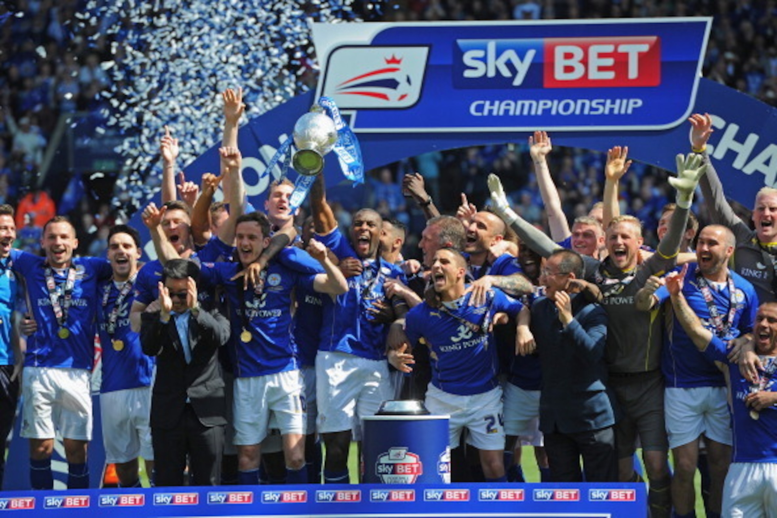 LEICESTER, ENGLAND - MAY 03: Wes Morgan of Leicester City lifts the Championship trophy after the Sky Bet Championship match between Leicester City and Doncaster Rovers at The King Power Stadium on May 3, 2014 in Leicester, England.  (Photo by Michael Reg