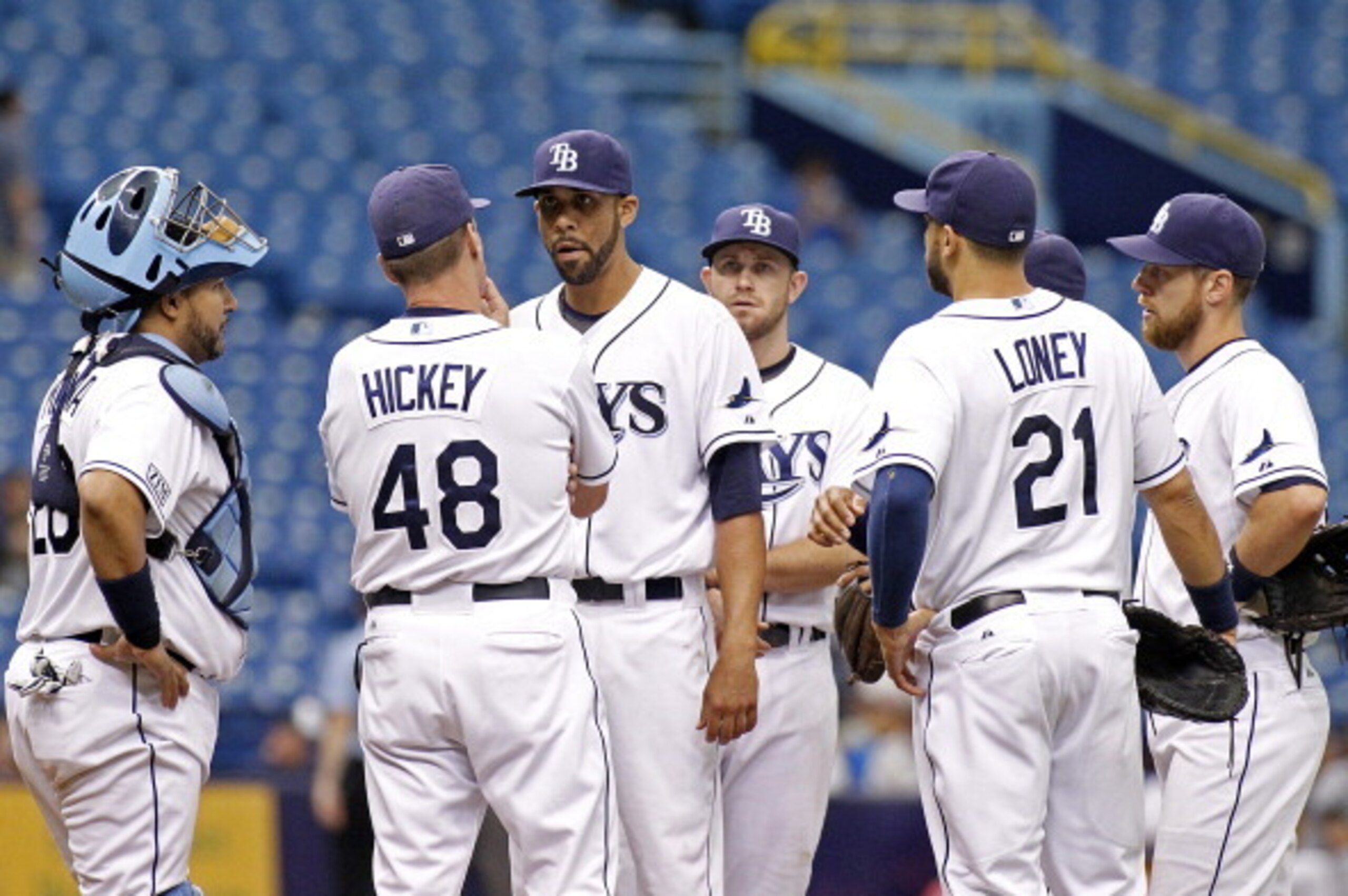 ST. PETERSBURG, FL - JUNE 9:  Pitching coach Jim Hickey #48 of the Tampa Bay Rays comes out to the mound to speak with pitcher David Price #14 of the Tampa Bay Rays after Price loaded the bases during the third inning of a game on June 9, 2014 at Tropican