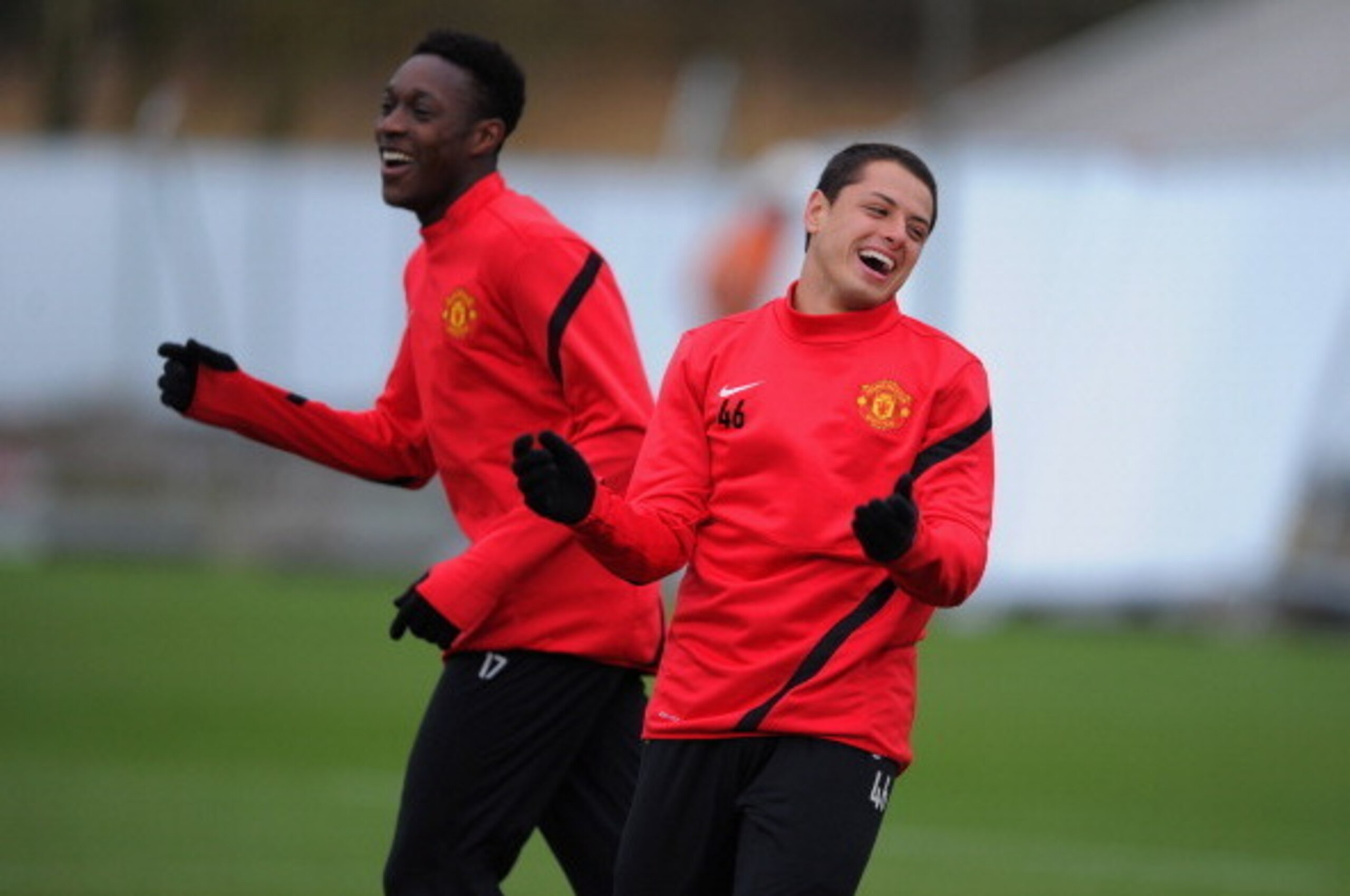 MANCHESTER, ENGLAND - FEBRUARY 22:  Javier Hernandez and Danny Welbeck share a joke during the Manchester United training ahead of their UEFA Europa League round of 32 second leg match against Ajax session at the Carrington Training Ground on February 22,