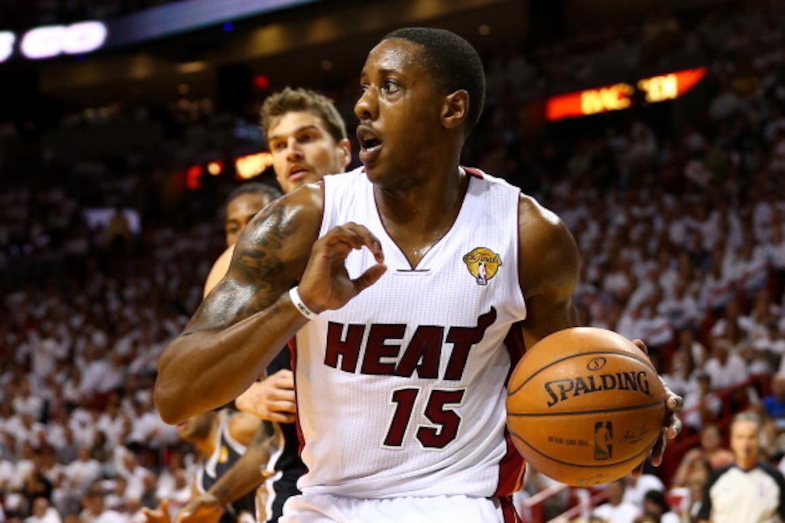 MIAMI, FL - JUNE 12:  Mario Chalmers #15 of the Miami Heat drives to the basket against Tiago Splitter #22 of the San Antonio Spurs during Game Four of the 2014 NBA Finals at American Airlines Arena on June 12, 2014 in Miami, Florida. NOTE TO USER: User e