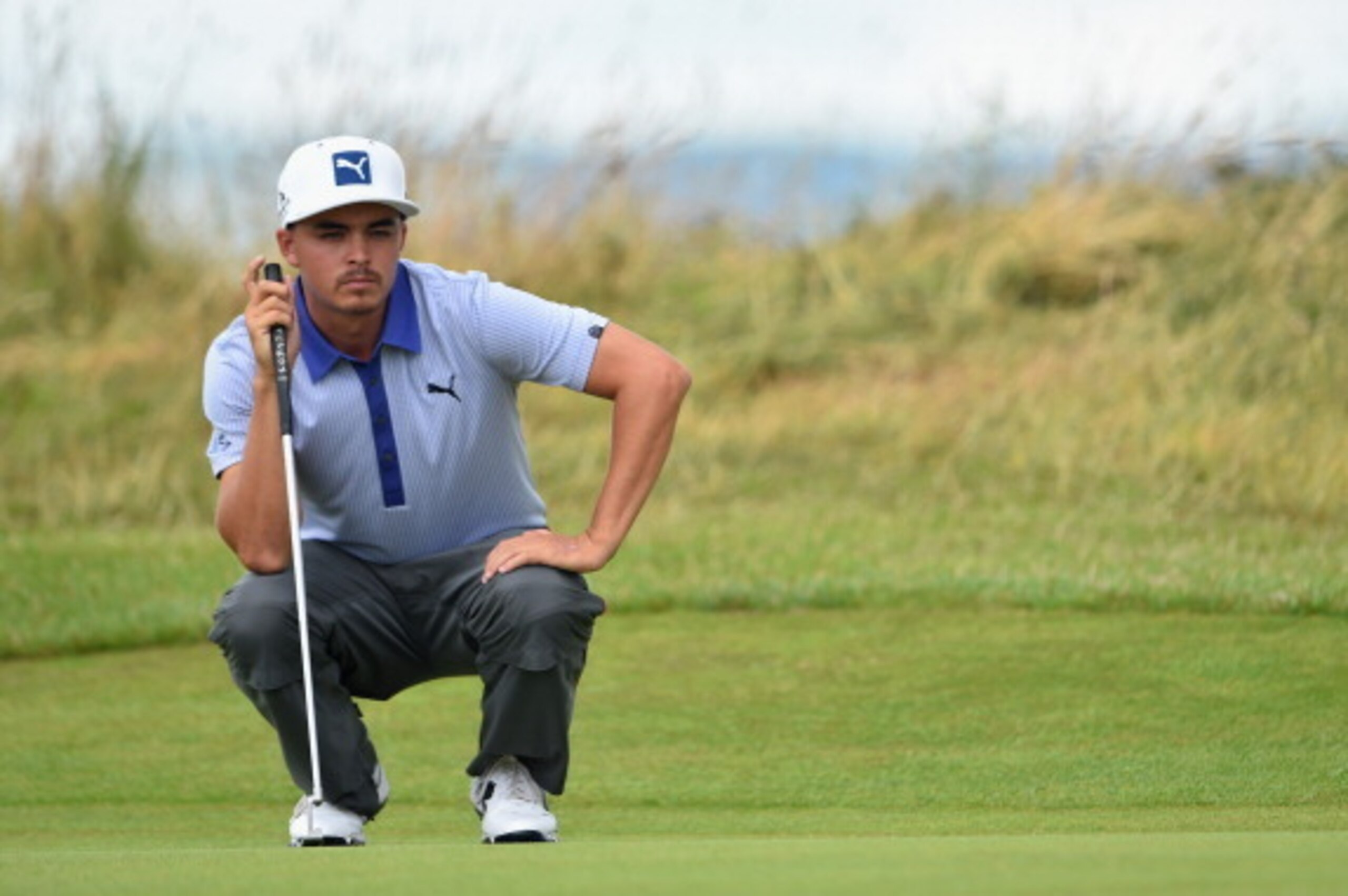 HOYLAKE, ENGLAND - JULY 19:  Rickie Fowler of the United States lines up a putt during the third round of The 143rd Open Championship at Royal Liverpool on July 19, 2014 in Hoylake, England.  (Photo by Stuart Franklin/Getty Images)