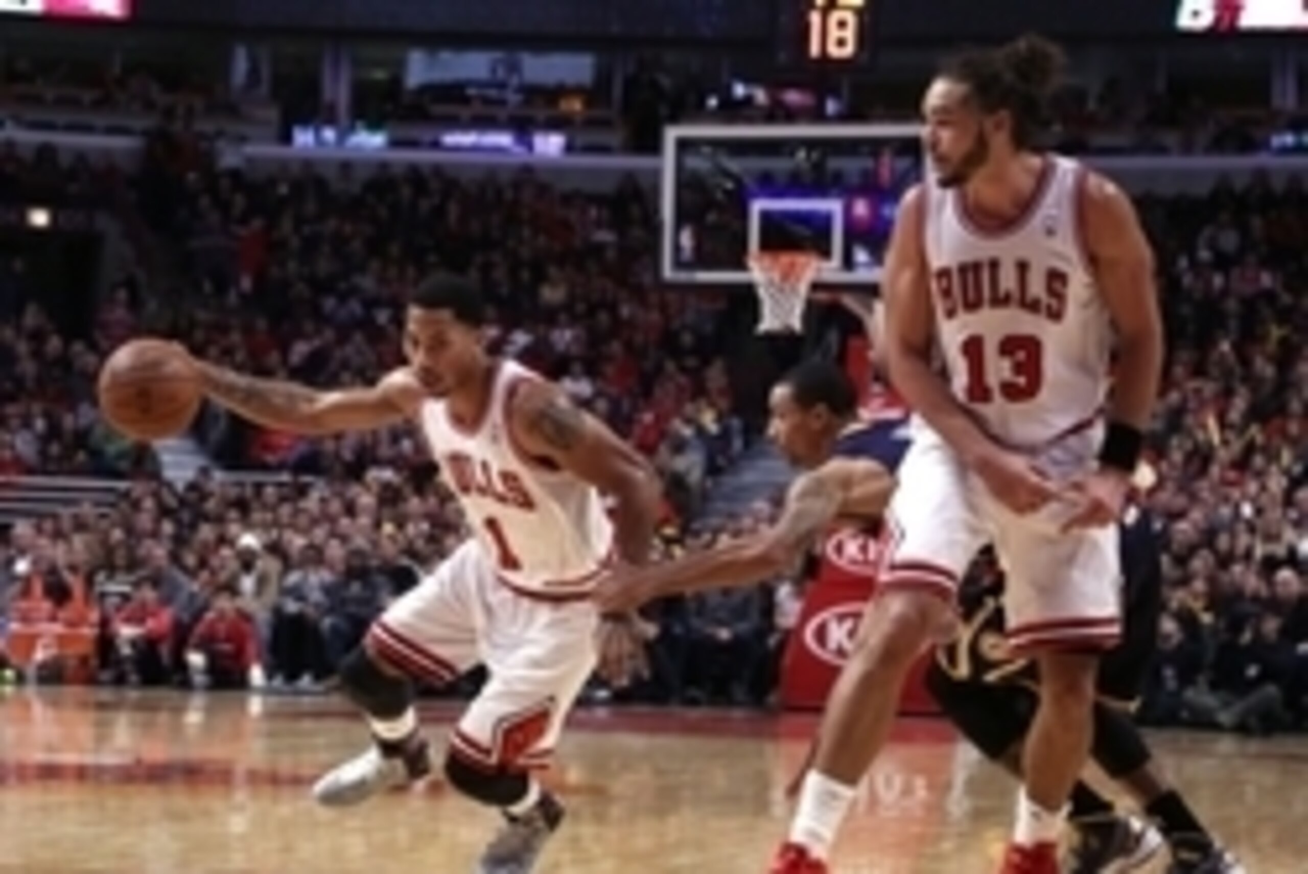 Nov 16, 2013; Chicago, IL, USA; Chicago Bulls point guard Derrick Rose (1) drives past Indiana Pacers point guard George Hill (3) with Chicago Bulls center Joakim Noah (13) setting a pick during the second quarter at  the United Center. Mandatory Credit: 
