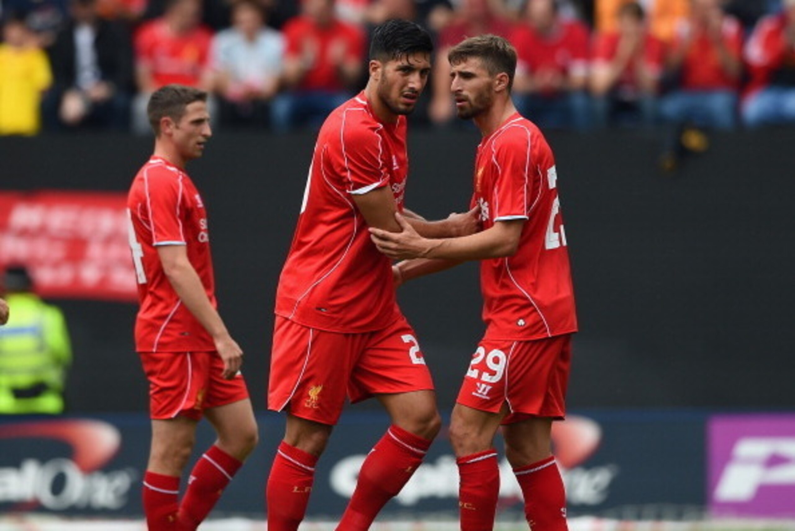 PRESTON, LANCASHIRE - JULY 19: Fabio Borini of Liverpool speaks to team mate Emre Can as he is substituted with an injury during the pre season friendly match between Preston North End and Liverpool at Deepdale on July 19, 2014 in Preston, Lancashire.  (P