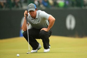HOYLAKE, ENGLAND - JULY 19:  Rory McIlroy of Northern Ireland lines up a putt during the third round of The 143rd Open Championship at Royal Liverpool on July 19, 2014 in Hoylake, England.  (Photo by Mike Ehrmann/Getty Images)