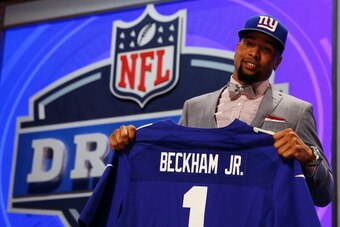 NEW YORK, NY - MAY 08:  Odell Beckham Jr of the LSU Tigers poses with a jersey after he was picked #12 overall by the New York Giants during the first round of the 2014 NFL Draft at Radio City Music Hall on May 8, 2014 in New York City.  (Photo by Elsa/Ge