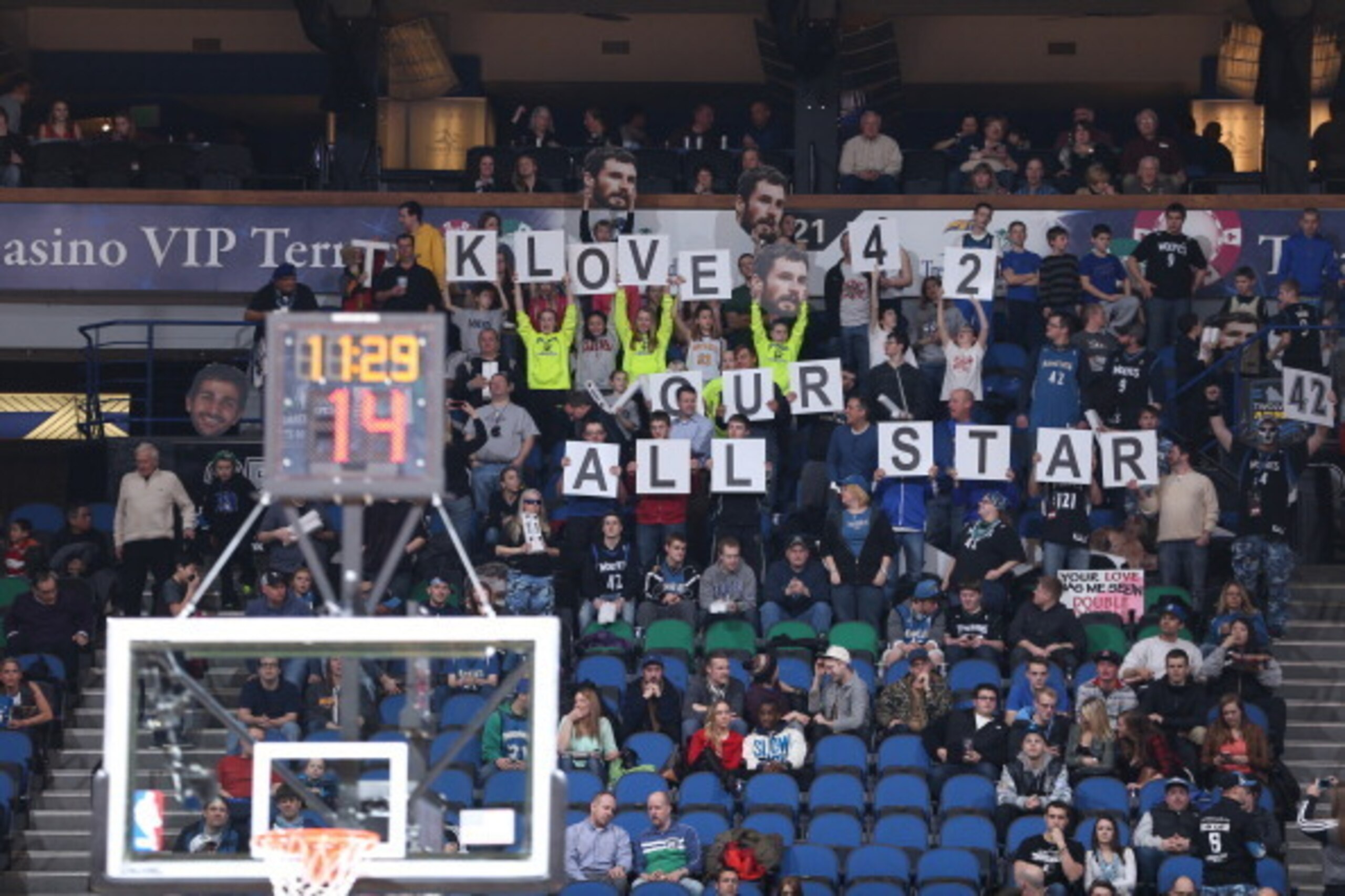 MINNEAPOLIS, MN - FEBRUARY 12:  The fans hold up signs in support of Kevin Love during the game against the Denver Nuggets on February 12, 2014 at Target Center in Minneapolis, Minnesota. NOTE TO USER: User expressly acknowledges and agrees that, by downl
