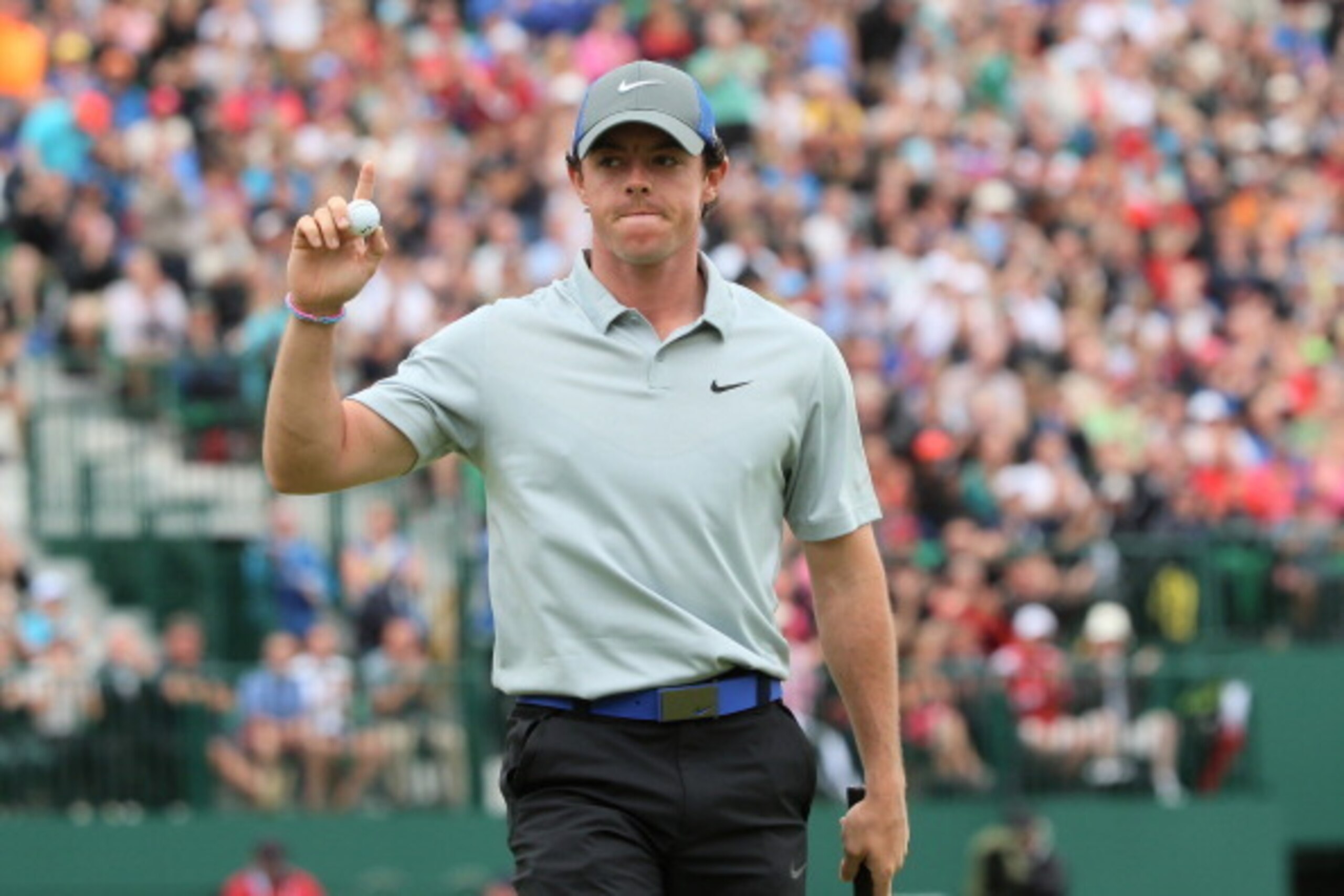 HOYLAKE, ENGLAND - JULY 19:  Rory McIlroy of Northern Ireland waves to the gallery on the 18th green after a four-under par 68 during the third round of The 143rd Open Championship at Royal Liverpool on July 19, 2014 in Hoylake, England.  (Photo by Andrew