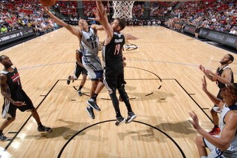 LAS VEGAS, NV - JULY 18: Dante Exum #11 of the Utah Jazz shoots against the Portland Trail Blazers at the Samsung NBA Summer League 2014 on July 18, 2014 at the Thomas & Mack Center in Las Vegas, Nevada. NOTE TO USER: User expressly acknowledges and agree