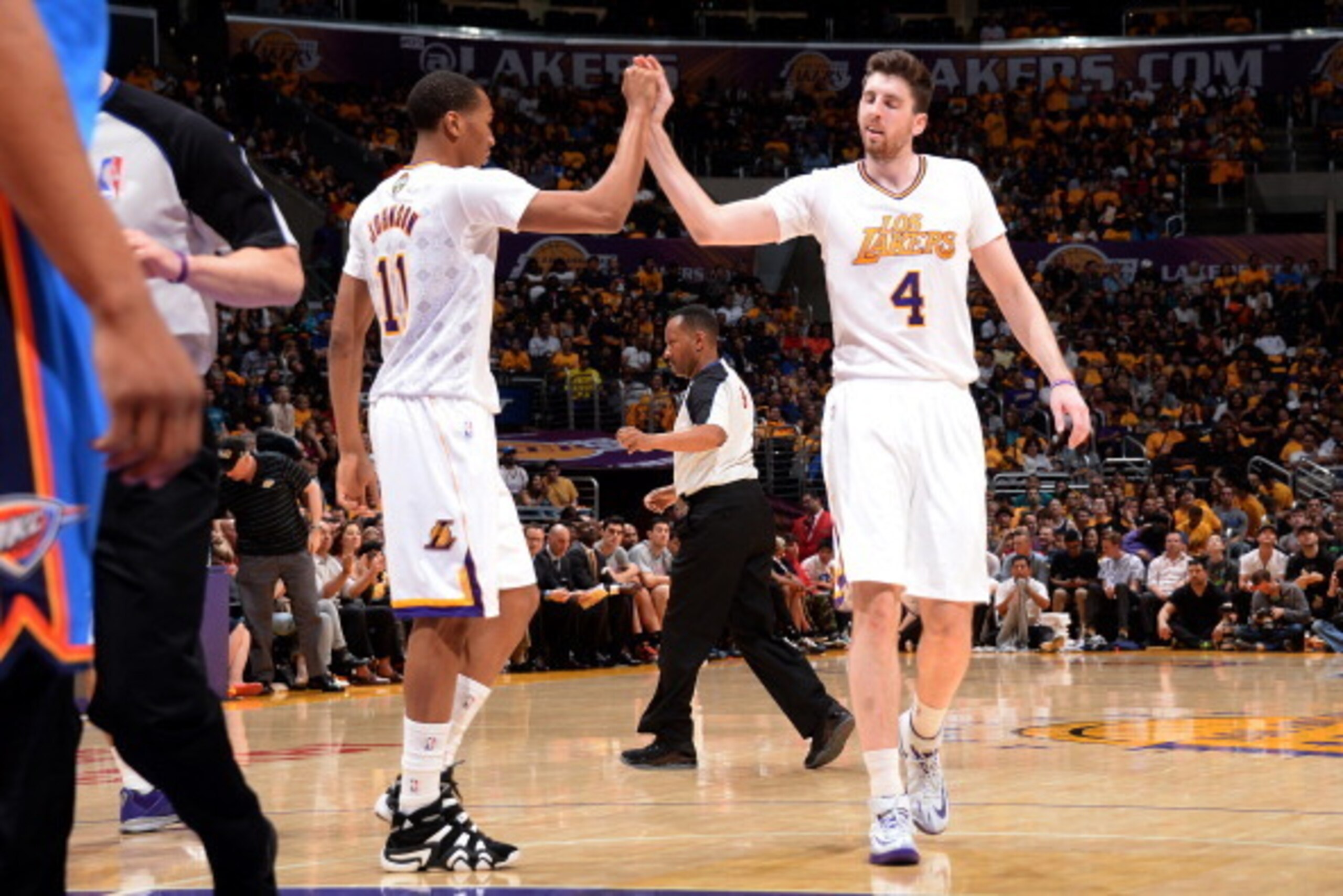 LOS ANGELES, CA - MARCH 9: Wesley Johnson #11 and Ryan Kelly #4 of the Los Angeles Lakers high five during a game against the Oklahoma City Thunder at STAPLES Center on March 9, 2014 in Los Angeles, California. NOTE TO USER: User expressly acknowledges an