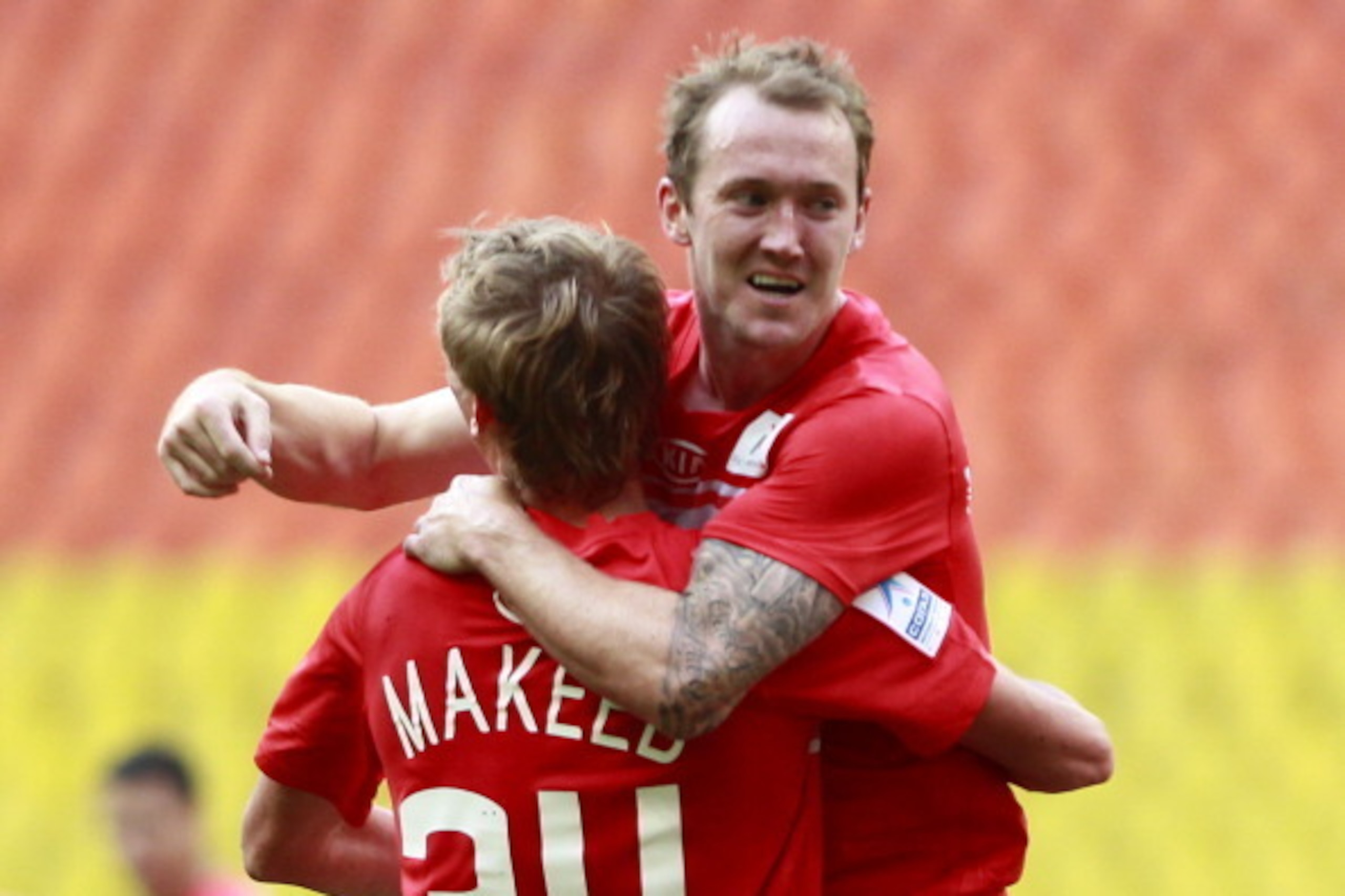 MOSCOW, RUSSIA - JULY 29: Aiden McGeady (R) and Evgeni Makeev of FC Spartak Moscow celebrate after scoring a goal during the Russian Premier League match between FC Spartak Moscow and FC Volga Nizhny Novgorod at the Luzhniki Stadium on July 29, 2012 in Mo