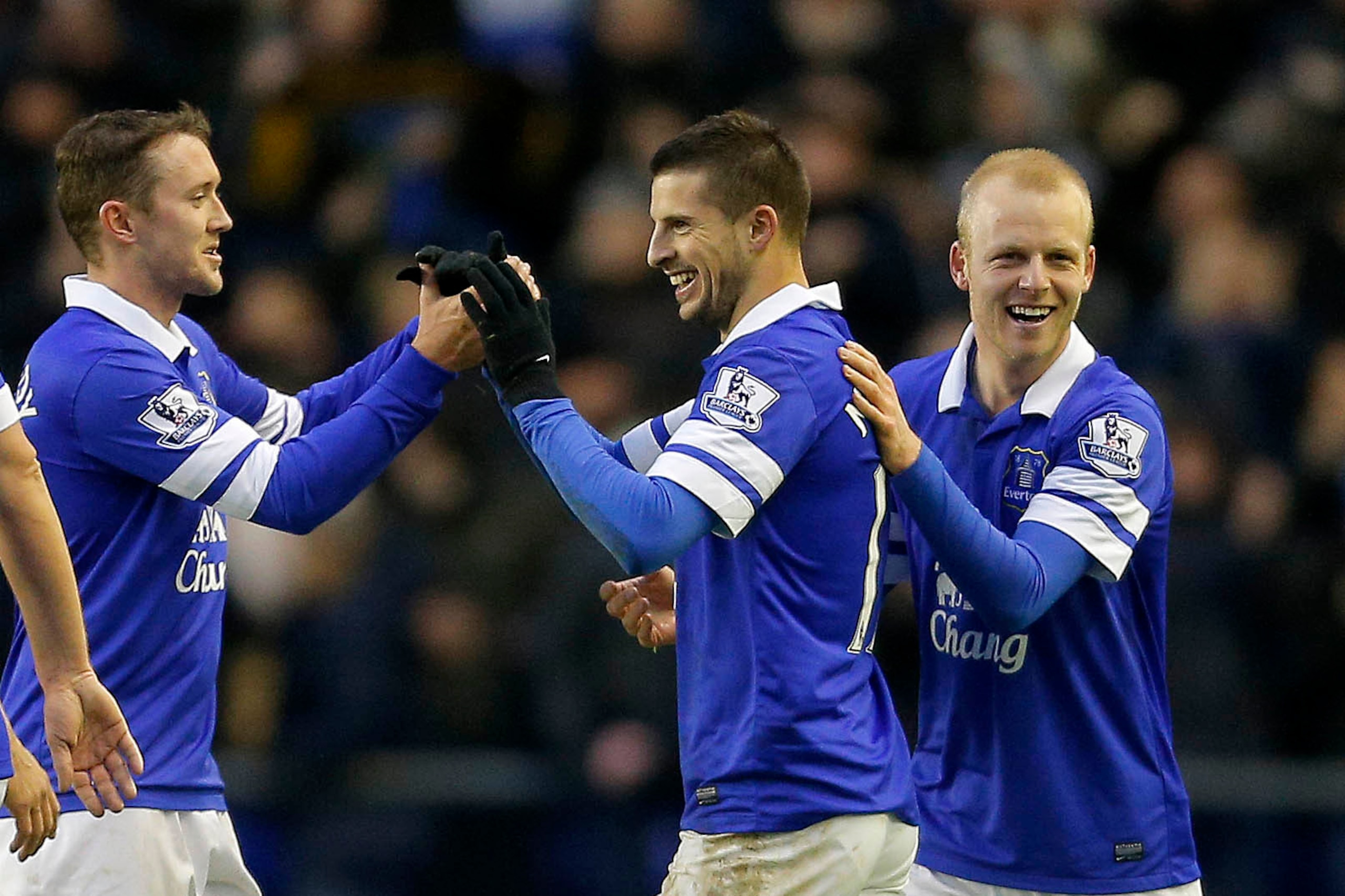 LIVERPOOL, ENGLAND - FEBRUARY 01: Kevin Mirallas (C) of Everton celebrates with his team-mates Aiden McGeady (L) and Steven Naismith (R) after scoring their second goal of the game during the Barclays Premier League match between Everton and Aston Villa a