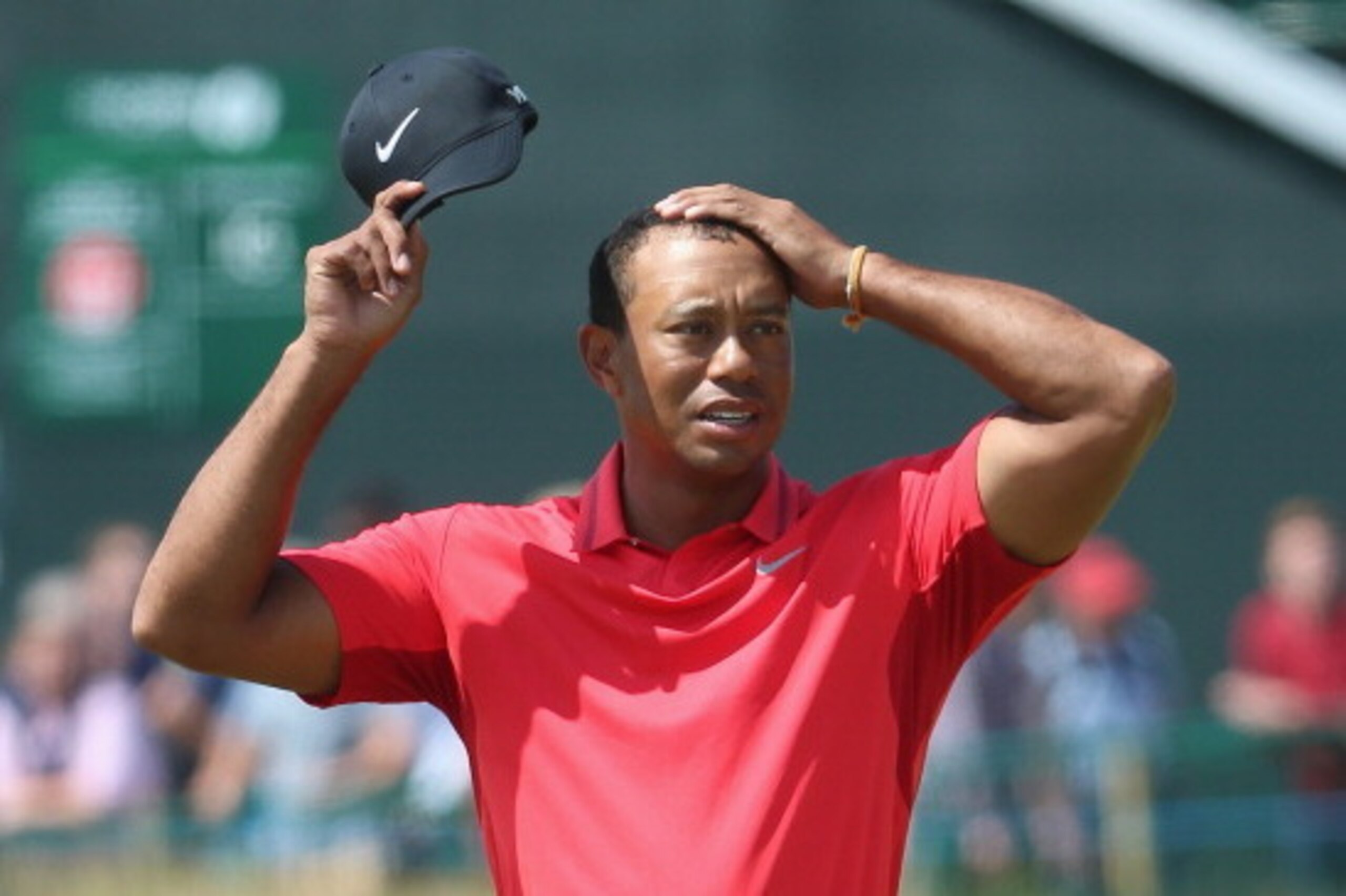 HOYLAKE, ENGLAND - JULY 20:  Tiger Woods of the United States reacts on the 18th green during the final round of The 143rd Open Championship at Royal Liverpool on July 20, 2014 in Hoylake, England.  (Photo by Andrew Redington/Getty Images)