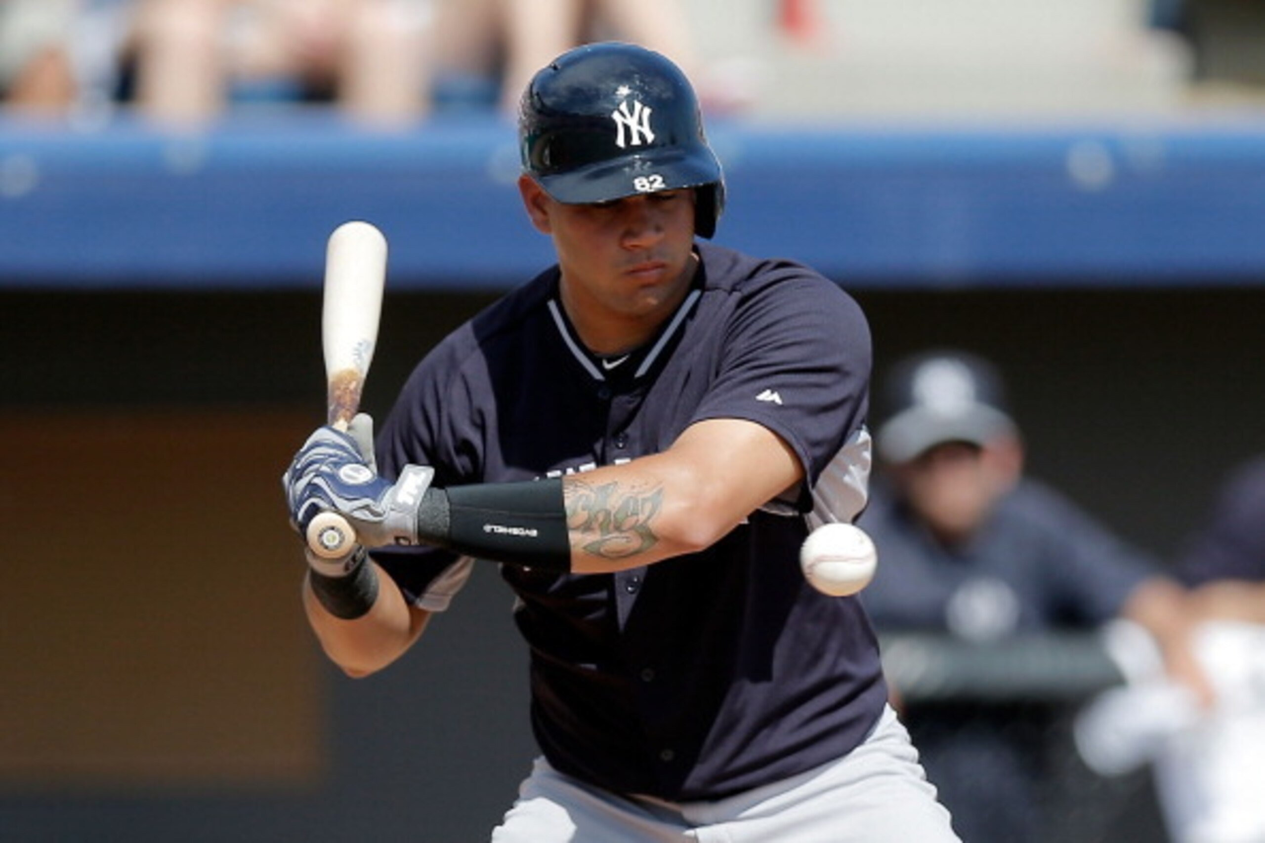 VIERA, FL - MARCH 11:  Gary Sanchez #82 of the New York Yankees takes a pitch against the Washington Nationals in the eighth inning of a game at the Space Coast Stadium on March 11, 2014 in Viera, Florida.  (Photo by Stacy Revere/Getty Images)