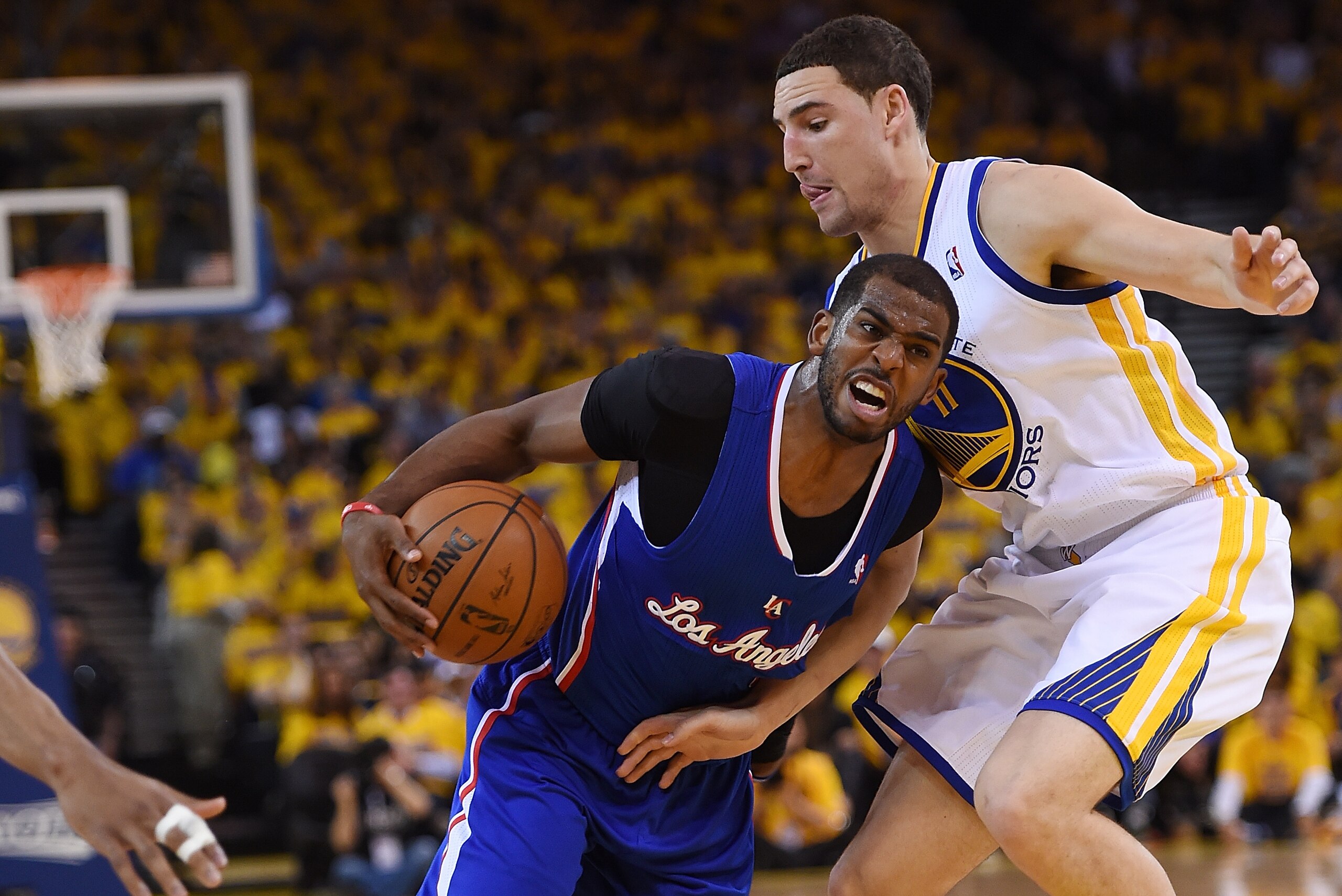 OAKLAND, CA - APRIL 27:  Chris Paul #3 of the Los Angeles Clippers drives on Klay Thompson #11 of the Golden State Warriors in Game Four of the Western Conference Quarterfinals during the 2014 NBA Playoffs at ORACLE Arena on April 27, 2014 in Oakland, Cal