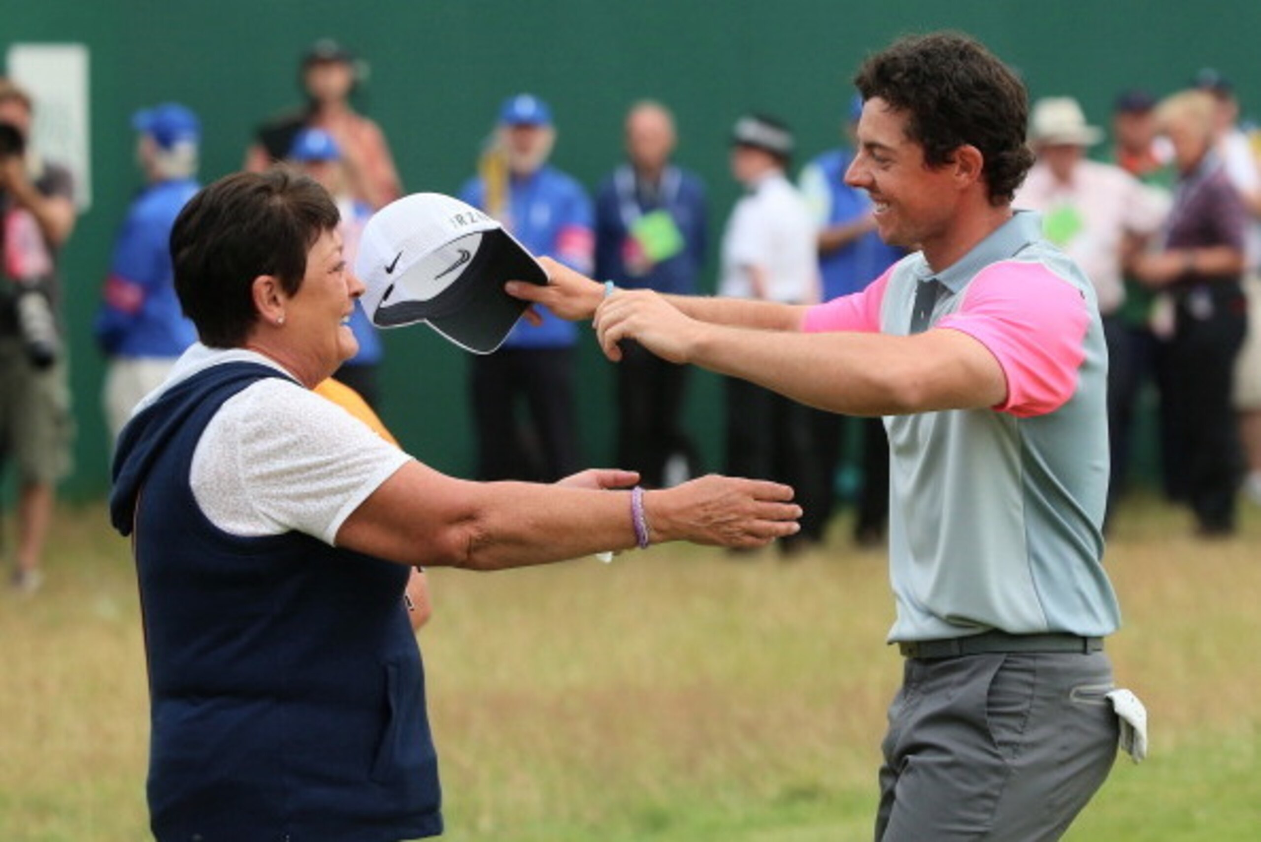 HOYLAKE, ENGLAND - JULY 20:  Rory McIlroy of Northern Ireland celebrates his two-stroke victory on the 18th green with his mother Rosie during the final round of The 143rd Open Championship at Royal Liverpool on July 20, 2014 in Hoylake, England.  (Photo 