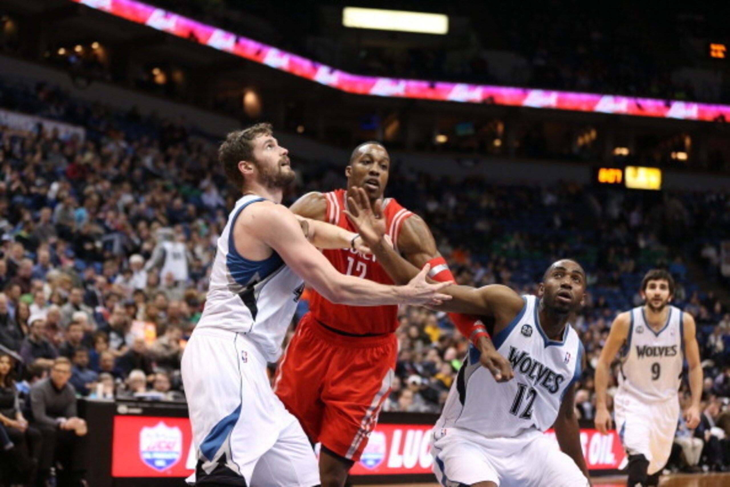 MINNEAPOLIS, MN - FEBRUARY 10: Kevin Love #42 of the Minnesota Timberwolves boxes out during the game against Dwight Howard #12 of the Houston Rockets on February 10, 2014 at Target Center in Minneapolis, Minnesota. NOTE TO USER: User expressly acknowledg