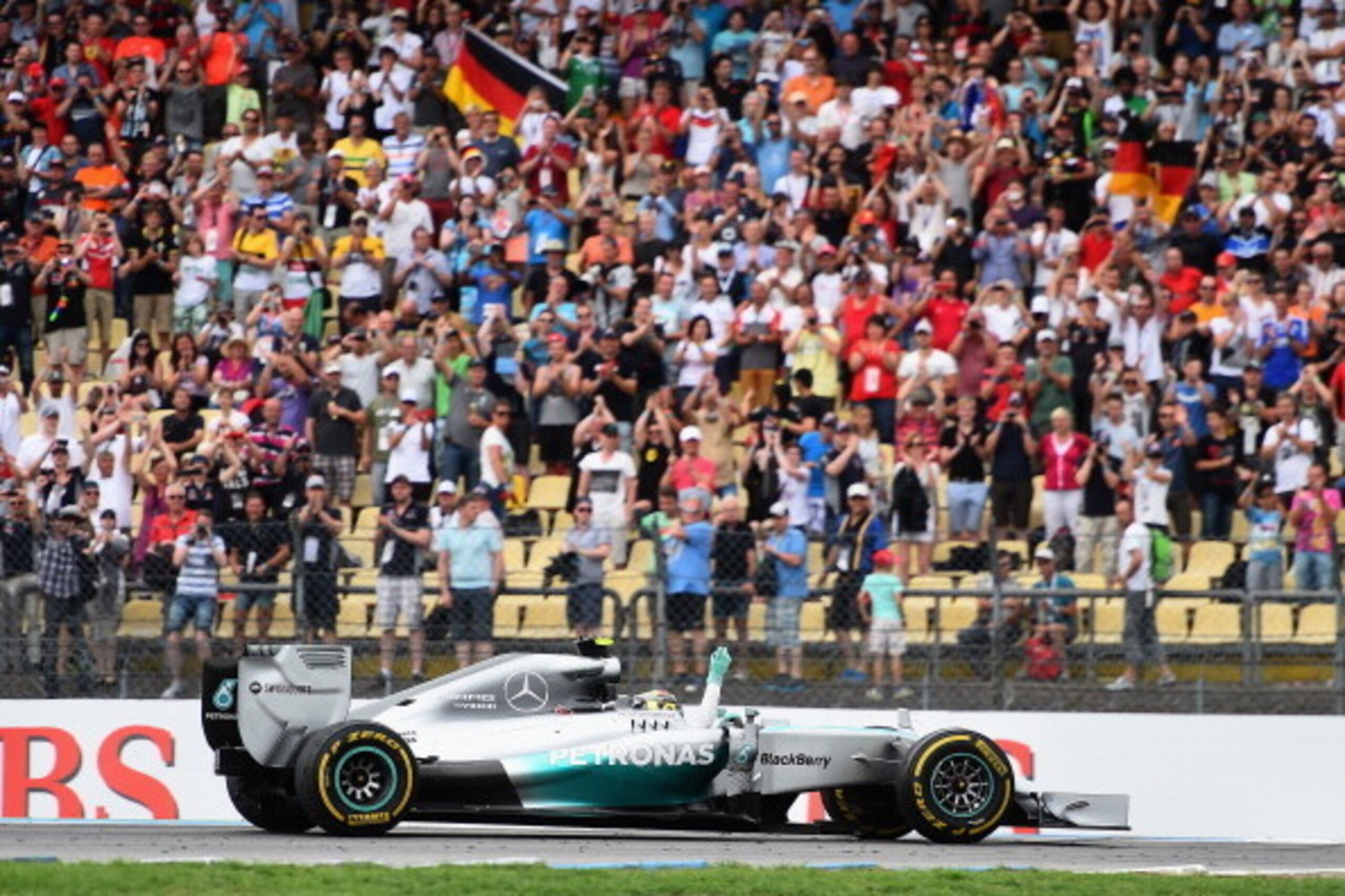 HOCKENHEIM, GERMANY - JULY 20:  Nico Rosberg of Germany and Mercedes GP waves to the fans during his victory lap after winning the German Grand Prix at Hockenheimring on July 20, 2014 in Hockenheim, Germany.  (Photo by Christopher Lee/Getty Images)