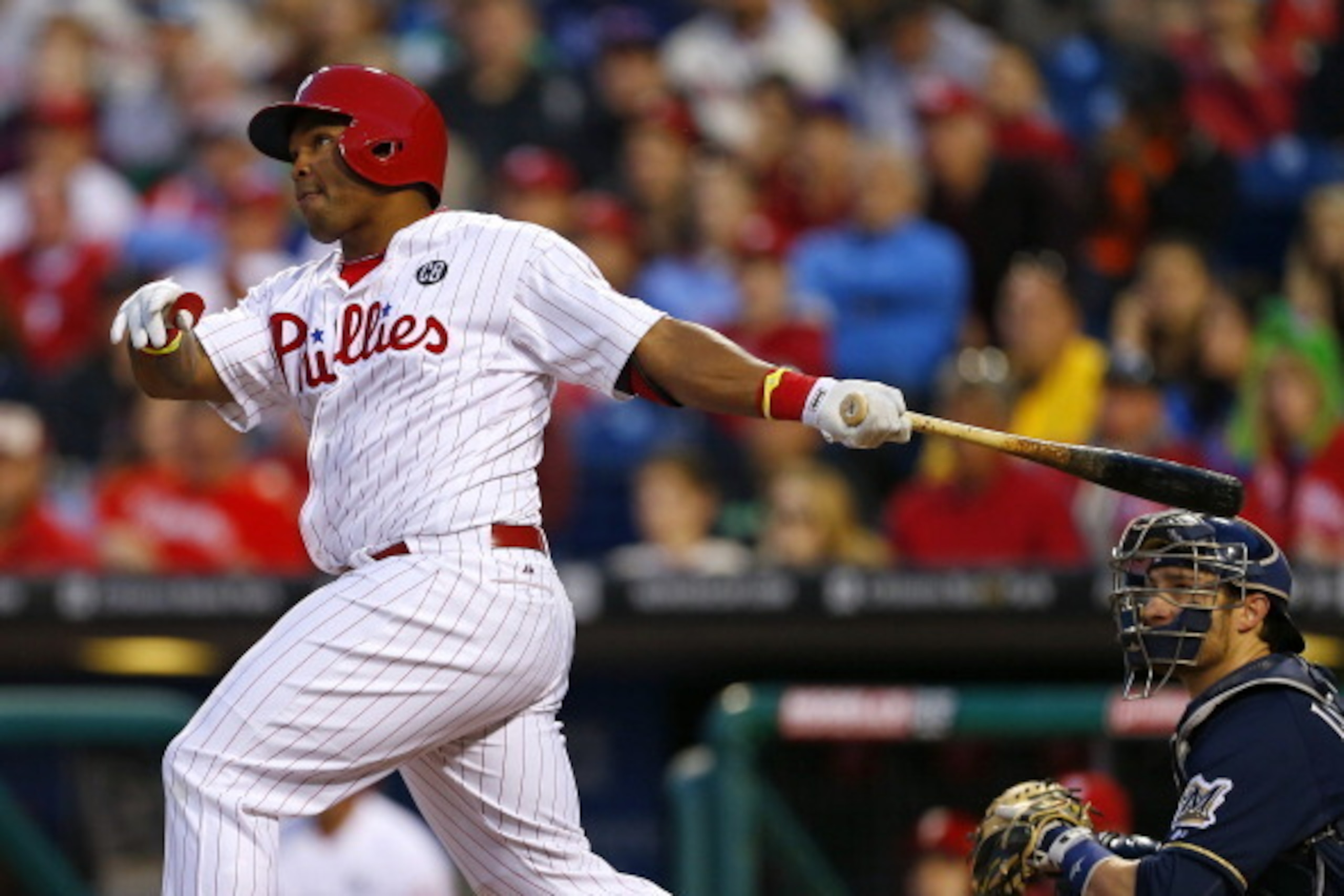 PHILADELPHIA, PA - APRIL 10: Marlon Byrd #3 of the Philadelphia Phillies hits a home run during the second inning in a game against the Milwaukee Brewers at Citizens Bank Park on April 10, 2014 in Philadelphia, Pennsylvania. (Photo by Rich Schultz/Getty I