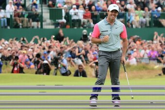 HOYLAKE, ENGLAND - JULY 20:  Rory McIlroy of Northern Ireland celebrates his two-stroke victory on the 18th green during the final round of The 143rd Open Championship at Royal Liverpool on July 20, 2014 in Hoylake, England.  (Photo by Andrew Redington/Ge