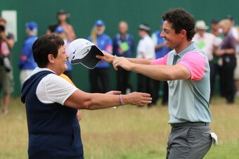 HOYLAKE, ENGLAND - JULY 20:  Rory McIlroy of Northern Ireland celebrates his two-stroke victory on the 18th green with his mother Rosie during the final round of The 143rd Open Championship at Royal Liverpool on July 20, 2014 in Hoylake, England.  (Photo 