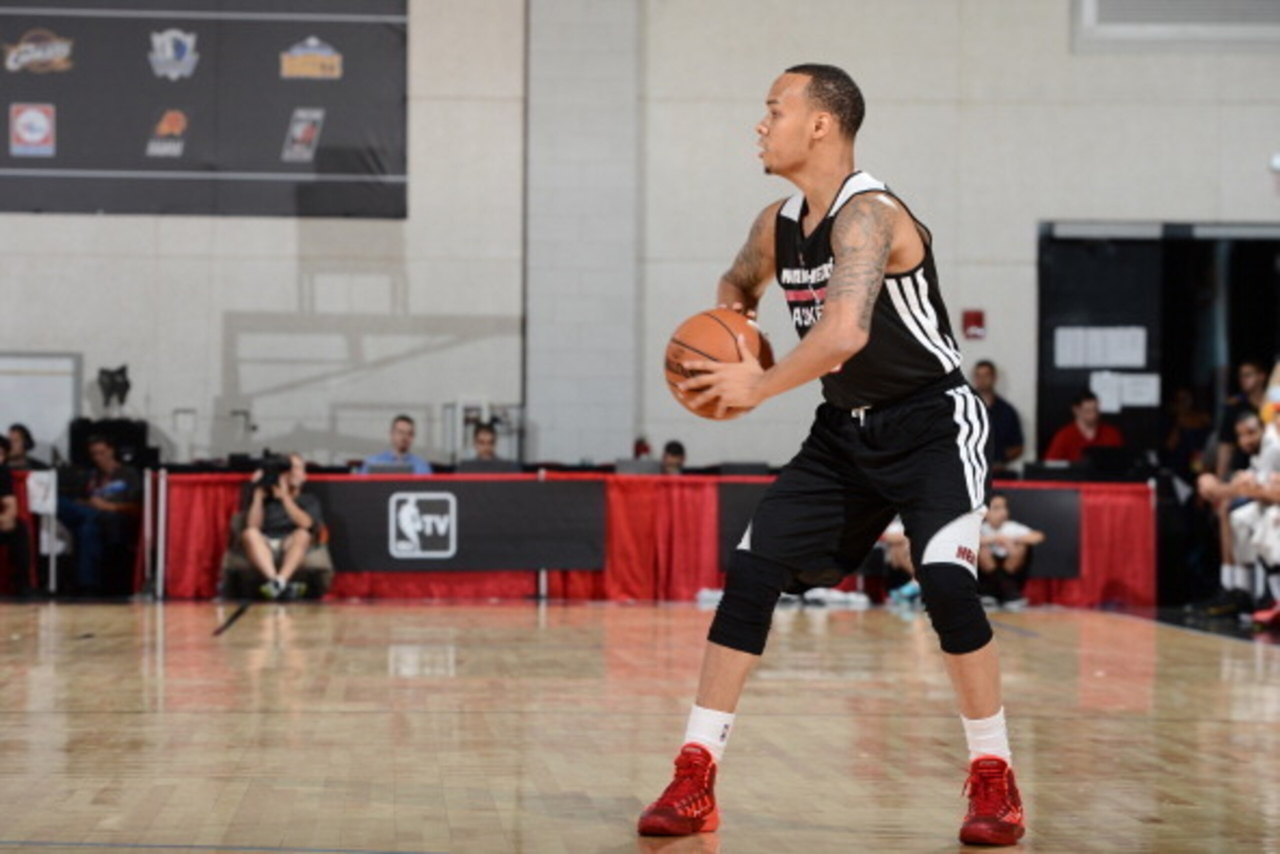 LAS VEGAS, NV - JULY 17:  Shabazz Napier #13 of the Miami Heat looks to pass against the Washington Wizards on July 17, 2014 at the Cox Pavilion in Las Vegas, Nevada. NOTE TO USER: User expressly acknowledges and agrees that, by downloading and or using t