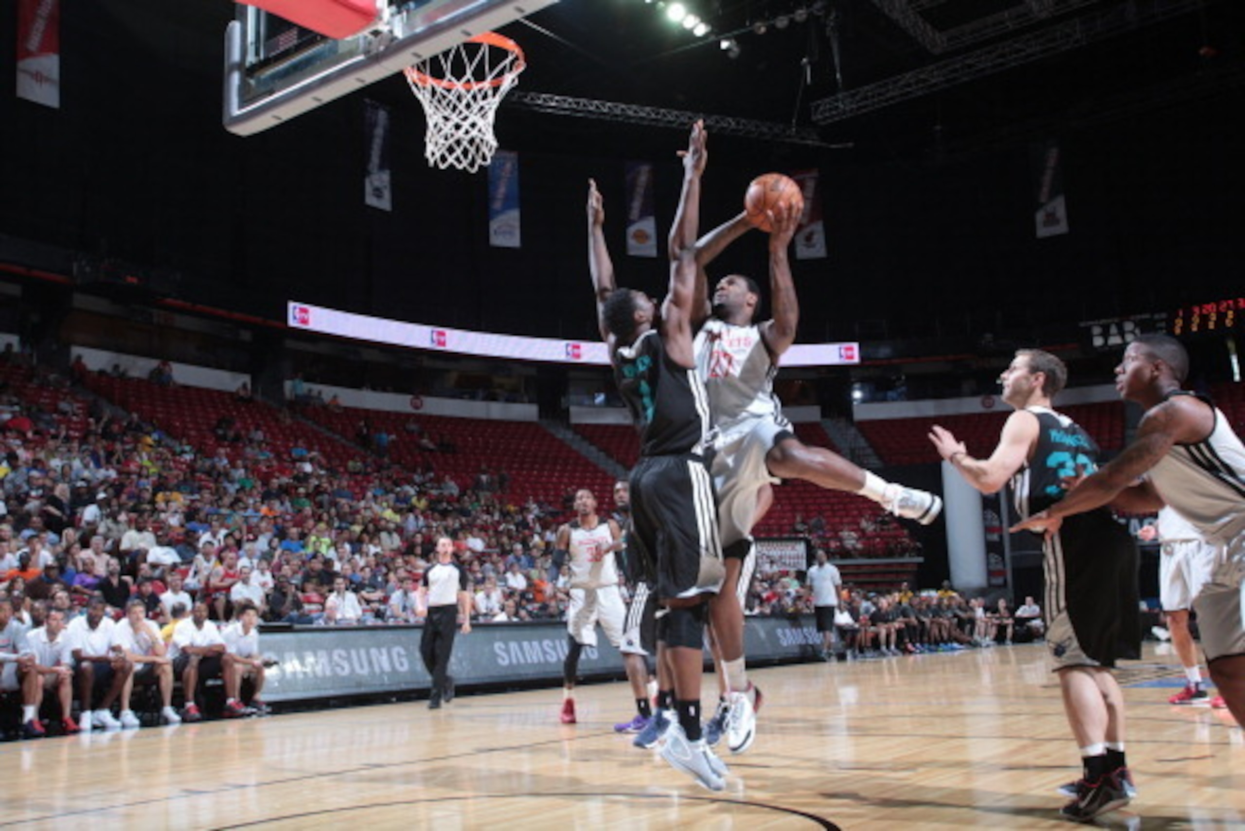 LAS VEGAS, NV - JULY 20: Tarik Black #27 of the Houston Rockets shoots against the Charlotte Hornets at the Samsung NBA Summer League 2014 on July 20, 2014 at the Thomas and Mack Center in Las Vegas, Nevada. NOTE TO USER: User expressly acknowledges and a