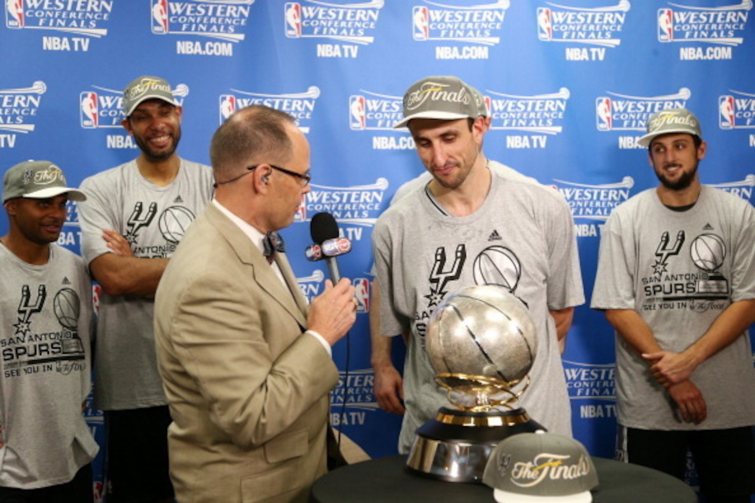 OKLAHOMA CITY, OK - MAY 31: Manu Ginobili #20 of the San Antonio Spurs gets interviewed by TNT Announcer Ernie Johnson after Game 6 of the Western Conference Finals during the 2014 NBA playoffs at Chesapeake Energy Arena on may 31, 2014 in Oklahoma City, 