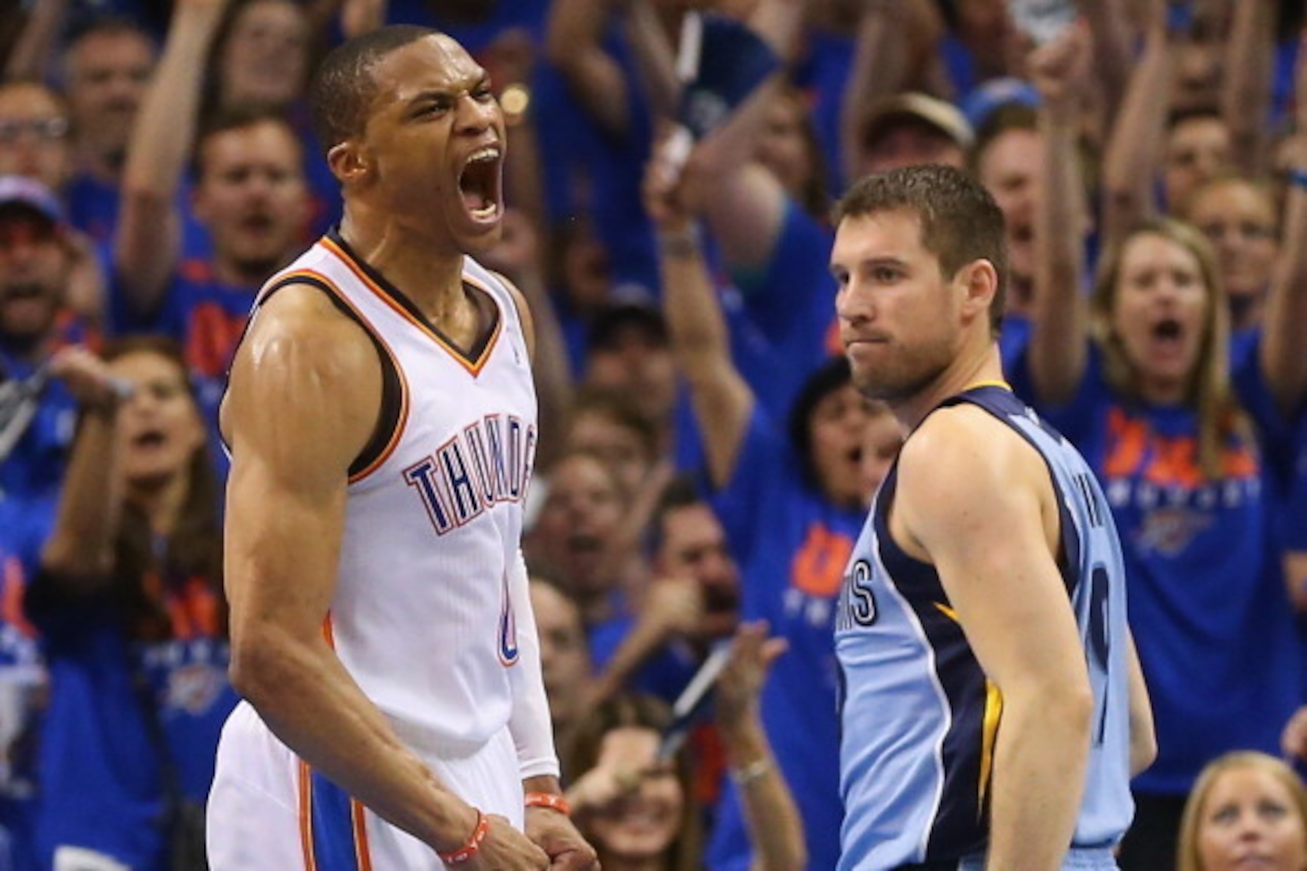 OKLAHOMA CITY, OK - MAY 03:  Russell Westbrook #0 of the Oklahoma City Thunder celebrates a play in front of Beno Udrih #19 of the Memphis Grizzlies in Game Seven of the Western Conference Quarterfinals during the 2014 NBA Playoffs at Chesapeake Energy Ar