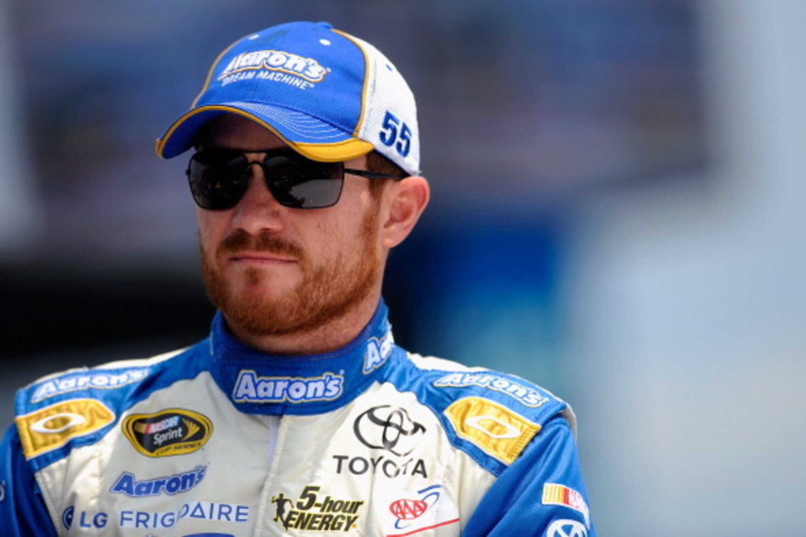 LOUDON, NH - JULY 13:  Brian Vickers, driver of the #55 Aaron's Dream Machine Toyota, looks on prior to the NASCAR Sprint Cup Series Camping World RV Sales 301 at New Hampshire Motor Speedway on July 13, 2014 in Loudon, New Hampshire.  (Photo by Jared C. 