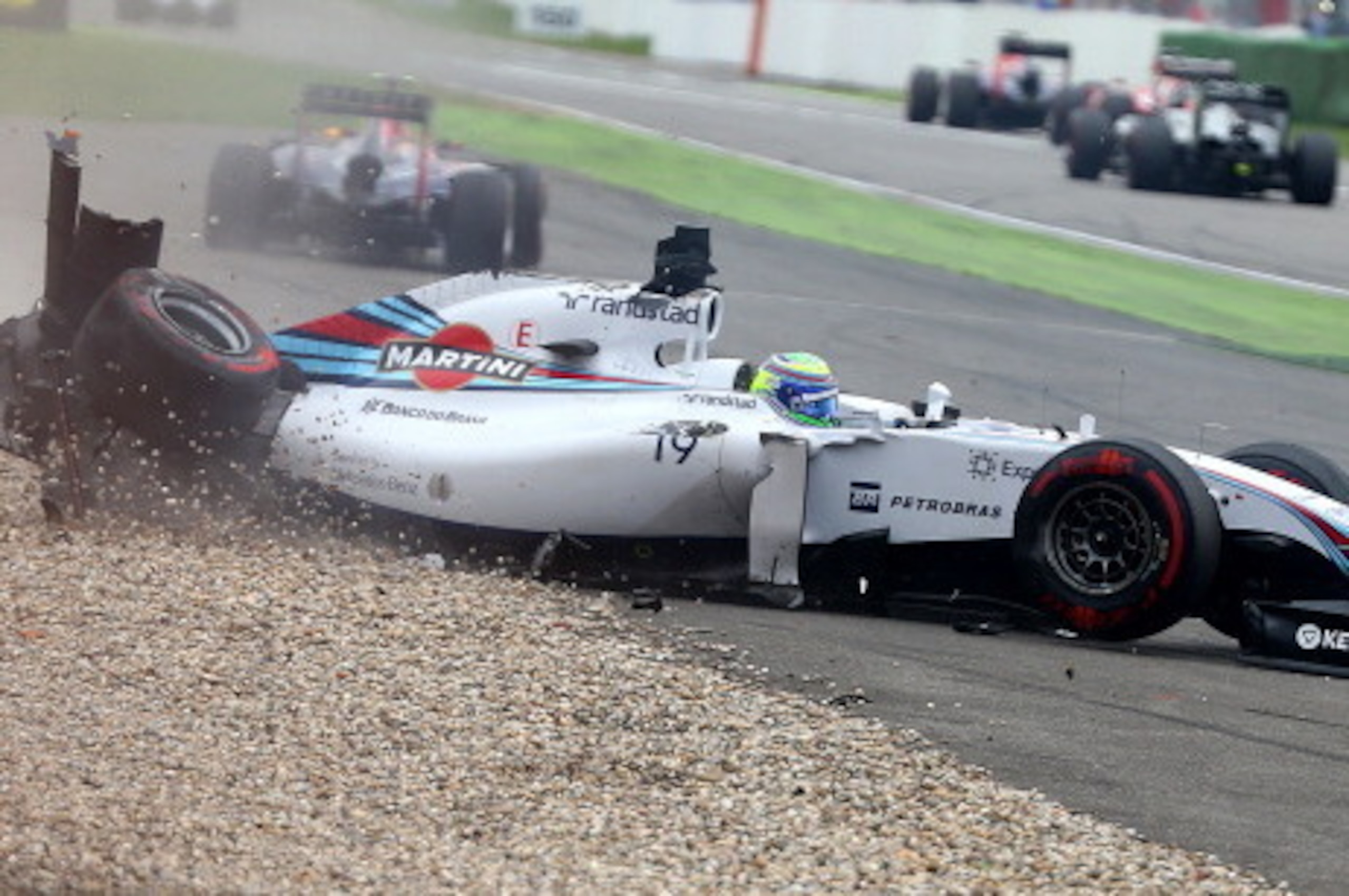 HOCKENHEIM, GERMANY - JULY 20:  Felipe Massa of Brazil and Williams crashes at the first corner during the German Grand Prix at Hockenheimring on July 20, 2014 in Hockenheim, Germany.  (Photo by Mark Thompson/Getty Images)