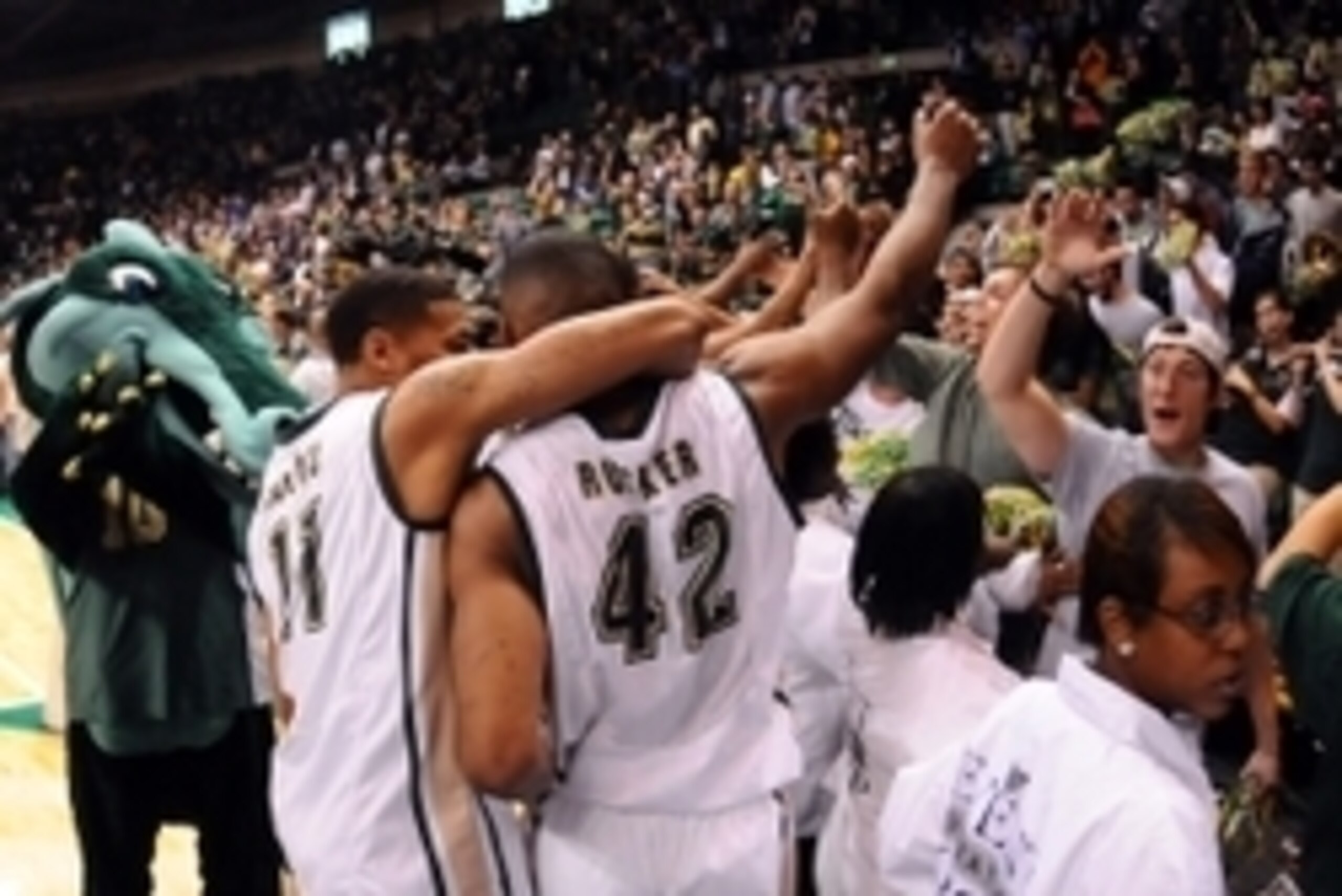 Dec 1, 2013; Birmingham, AL, USA; UAB Blazers Thaddeus Rideau (11) and Rod Rucker (42) are greeted by fans after their 63-59 win over the North Carolina Tar Heels at Bartow Arena. Mandatory Credit: Kelly Lambert-USA TODAY Sports