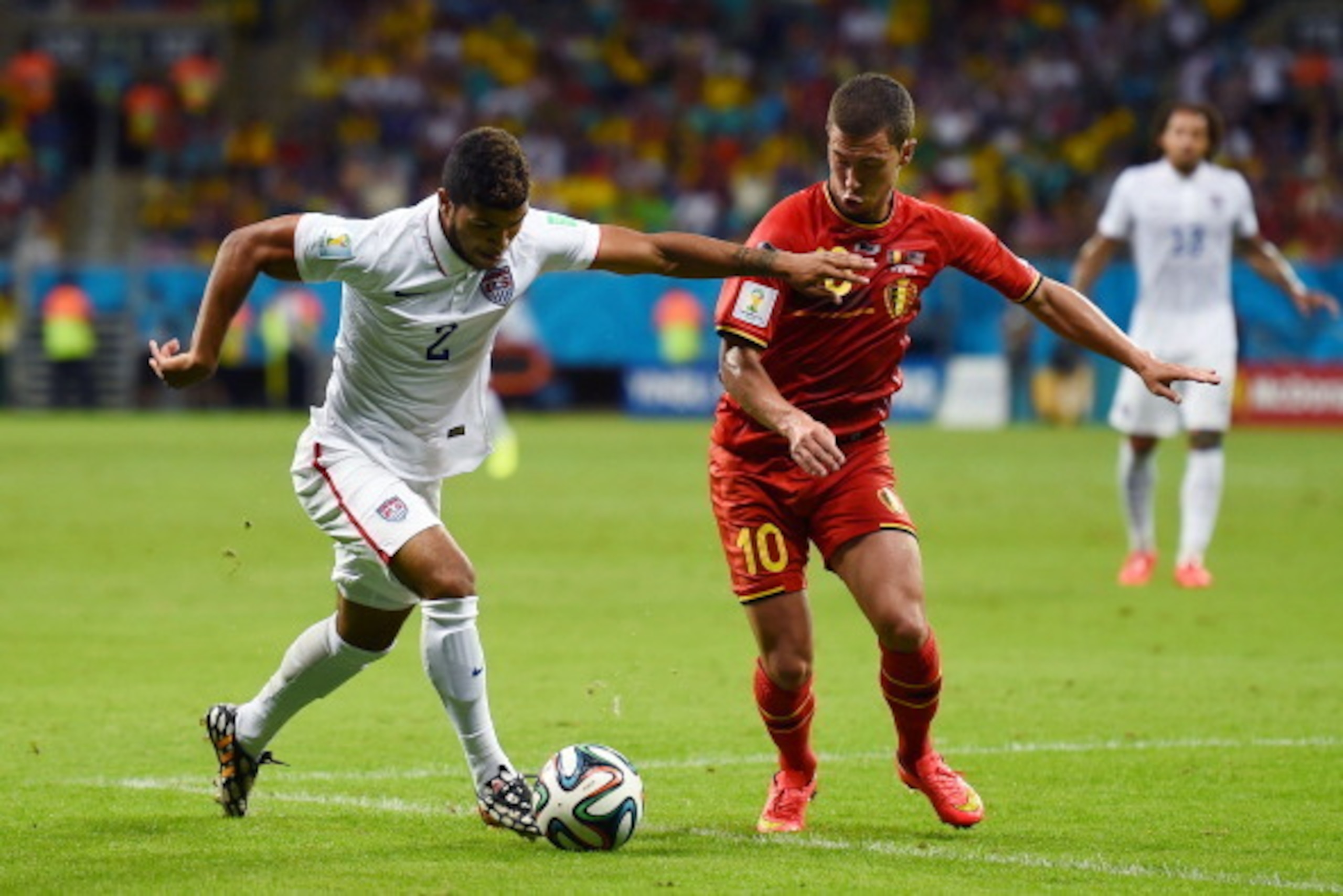 SALVADOR, BRAZIL - JULY 01: DeAndre Yedlin of the United States controls the ball against Eden Hazard of Belgium during the 2014 FIFA World Cup Brazil Round of 16 match between Belgium and the United States at Arena Fonte Nova on July 1, 2014 in Salvador,