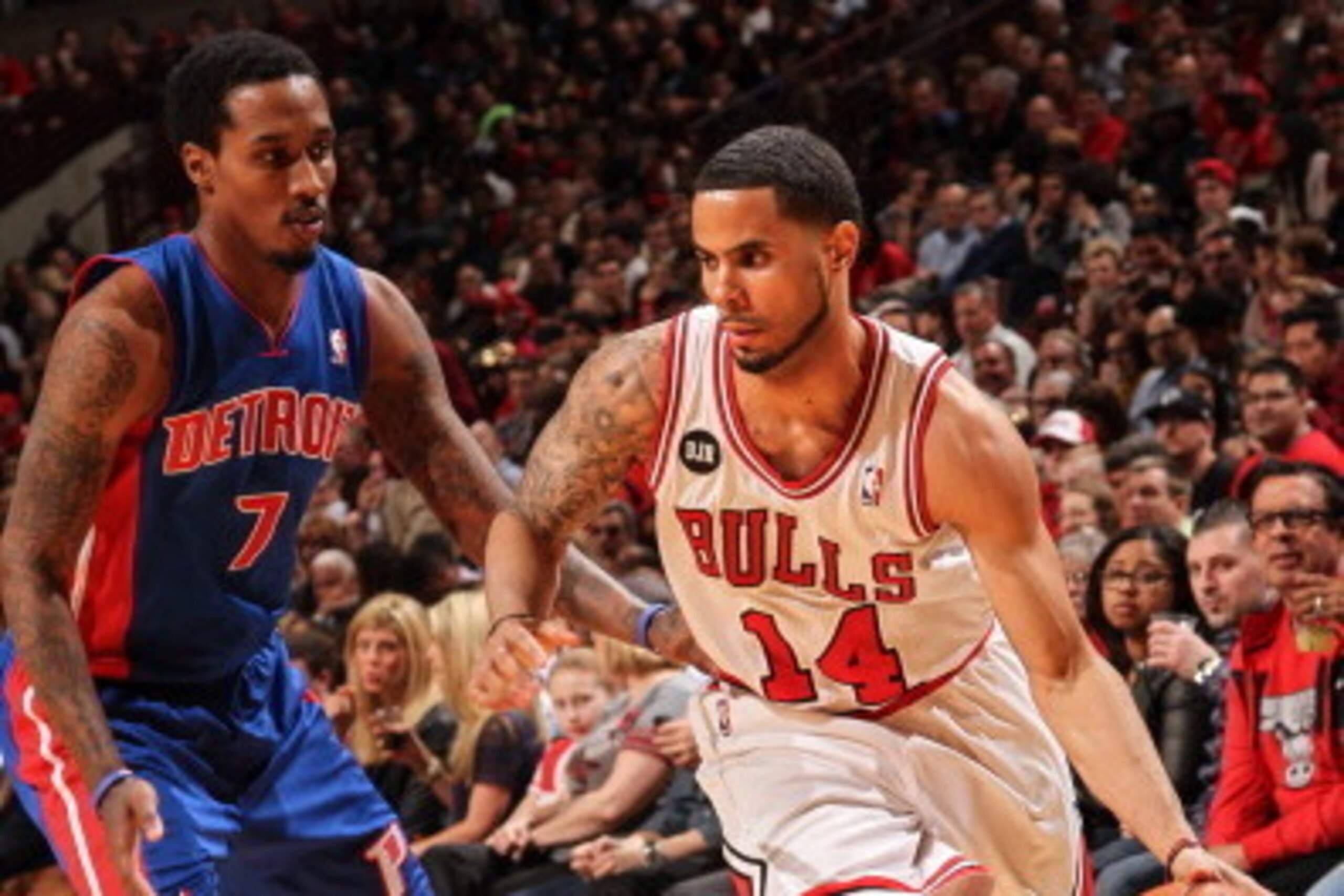 CHICAGO, IL - APRIL 11: D.J. Augustin #14 of the Chicago Bulls is guarded by Brandon Jennings #7 of the Detroit Pistons on April 11, 2014 at the United Center in Chicago, Illinois. NOTE TO USER: User expressly acknowledges and agrees that, by downloading 