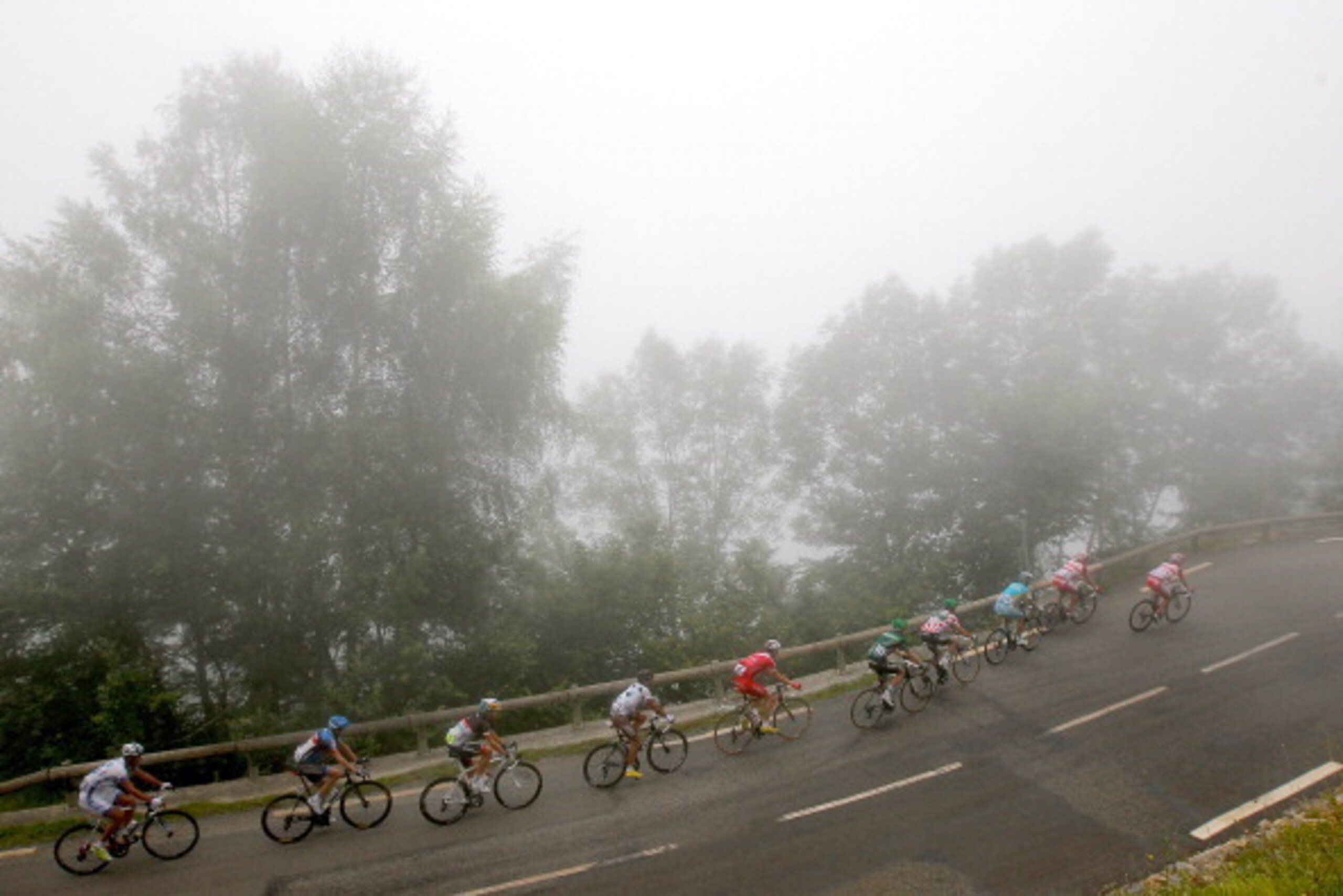 BOUTX, FRANCE - JULY 19:  The breakaway makes the climb of the Col de Mente during stage seventeen of the 2012 Tour de France from Bagneres-de-Luchon to Peyragudes on July 19, 2012 in Boutx, France.  (Photo by Doug Pensinger/Getty Images)