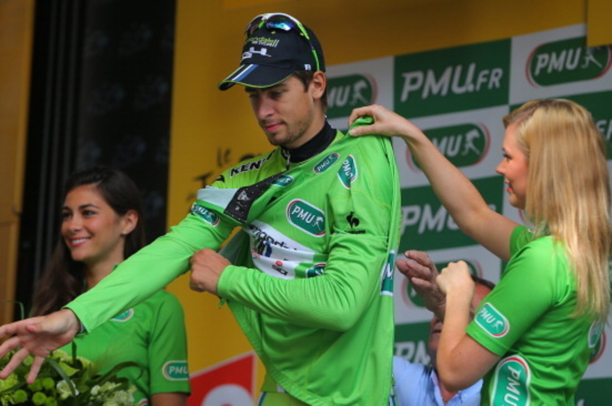 NIMES, FRANCE - JULY 20:  Peter Sagan of Slovakia and Cannondale takes the podium after defending the points leader's green jersey during the fifteenth stage of the 2014 Tour de France, a 222km stage between Tallard and Nimes, on July 20, 2014 in Nimes, F