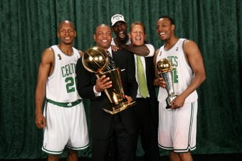 BOSTON - JUNE 17: (L-R) Ray Allen #20, Head Coach Doc Rivers, Kevin Garnett #5, General Manager Danny Ainge and Paul Pierce #34 of the Boston Celtics pose for a portrait with the Larry O'Brien trophy after defeating the Los Angeles Lakers in Game Six of t
