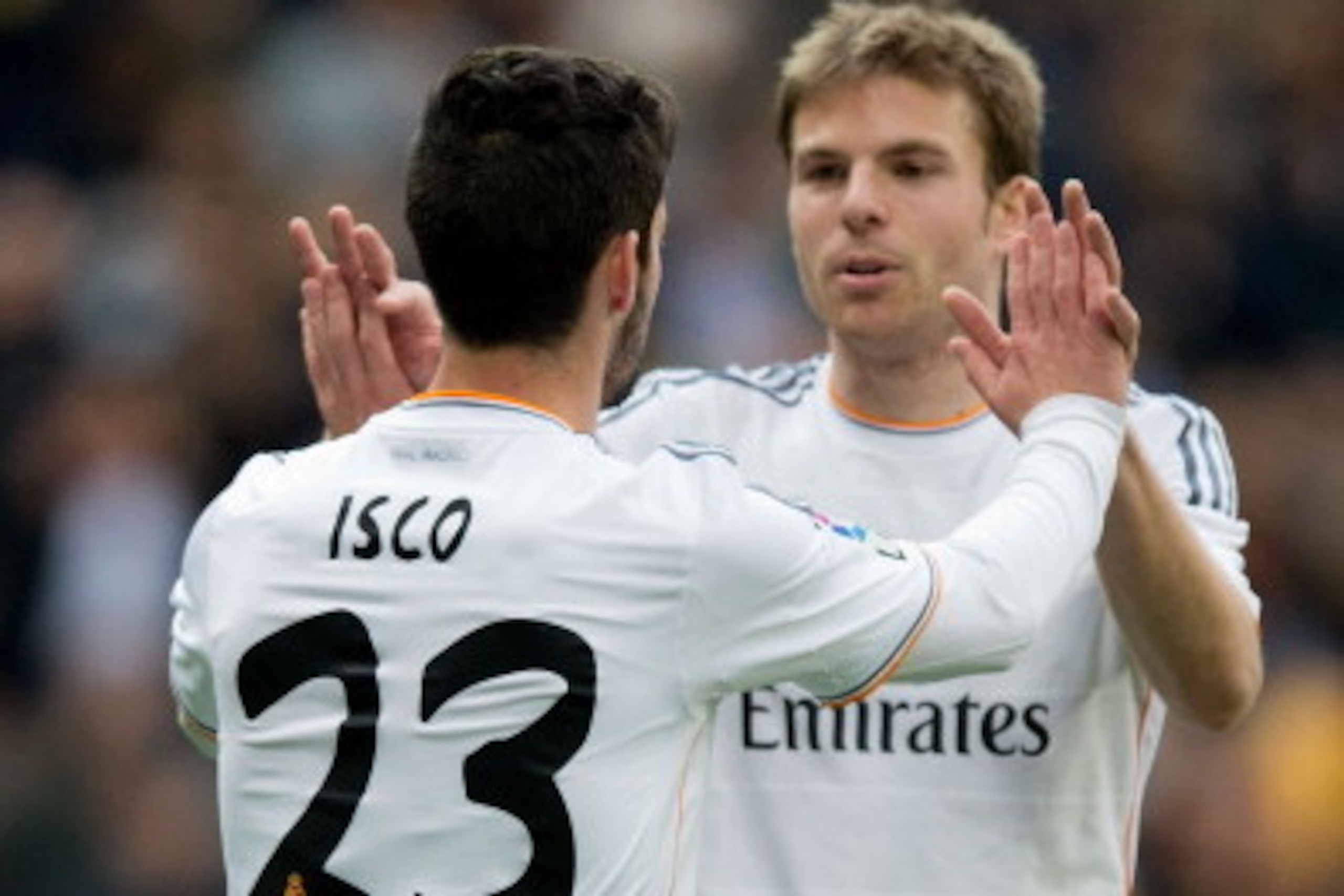 MADRID, SPAIN - FEBRUARY 22:  Isco (L) of Real Madrid CF celebrates scoring their third goal with teammate Asier Illarramendi (R) during the La Liga match between Real Madrid CF and Elche CF at Estadio Santiago Bernabeu on February 22, 2014 in Madrid, Spa