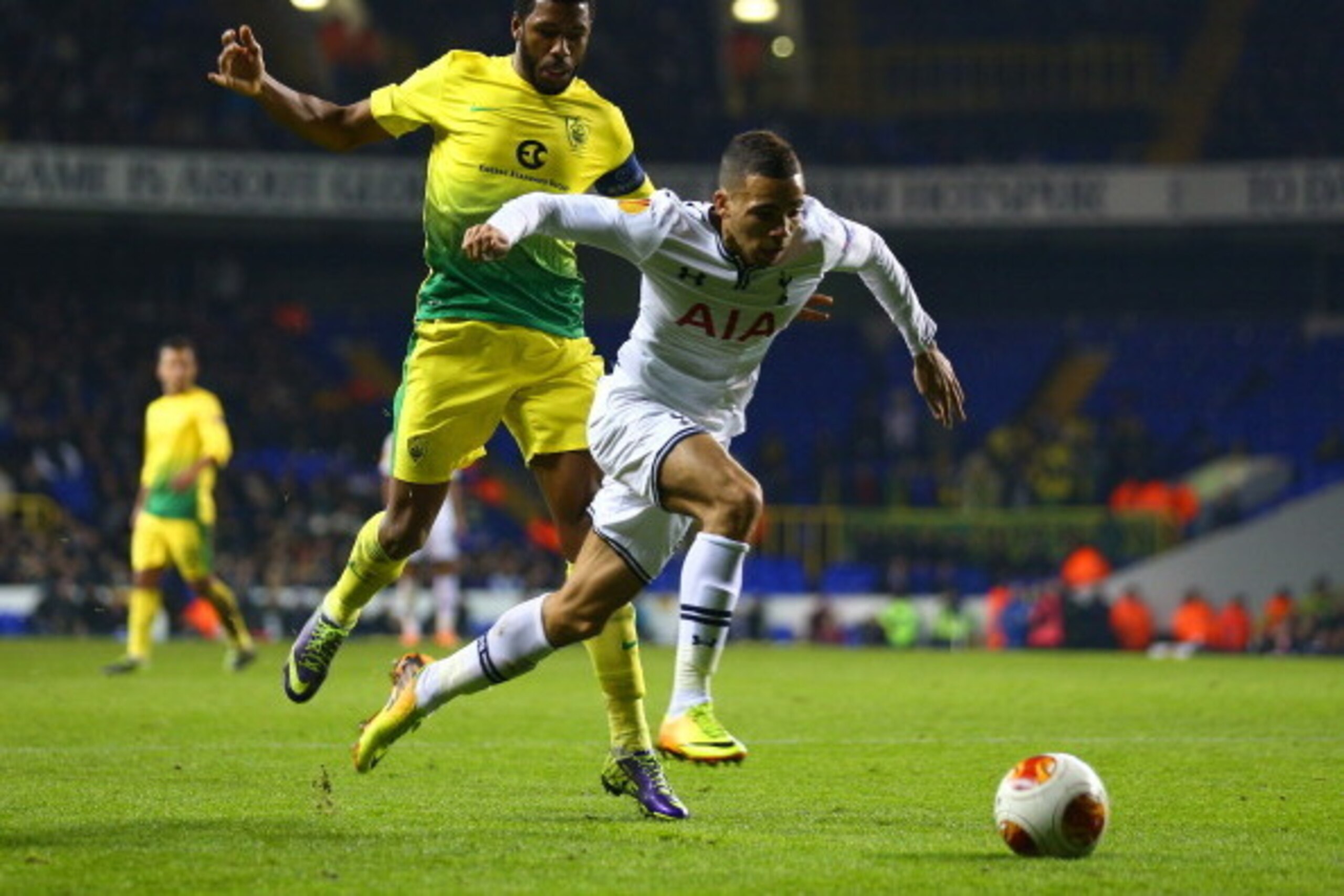 LONDON, ENGLAND - DECEMBER 12:  Jucilei of Anzhi Makhachkala and Ryan Fredericks of Tottenham Hotspur compete for the ball during the UEFA Europa League Group K match between Tottenham Hotspur FC and FC Anji Makhachkala at White Hart Lane on December 12, 