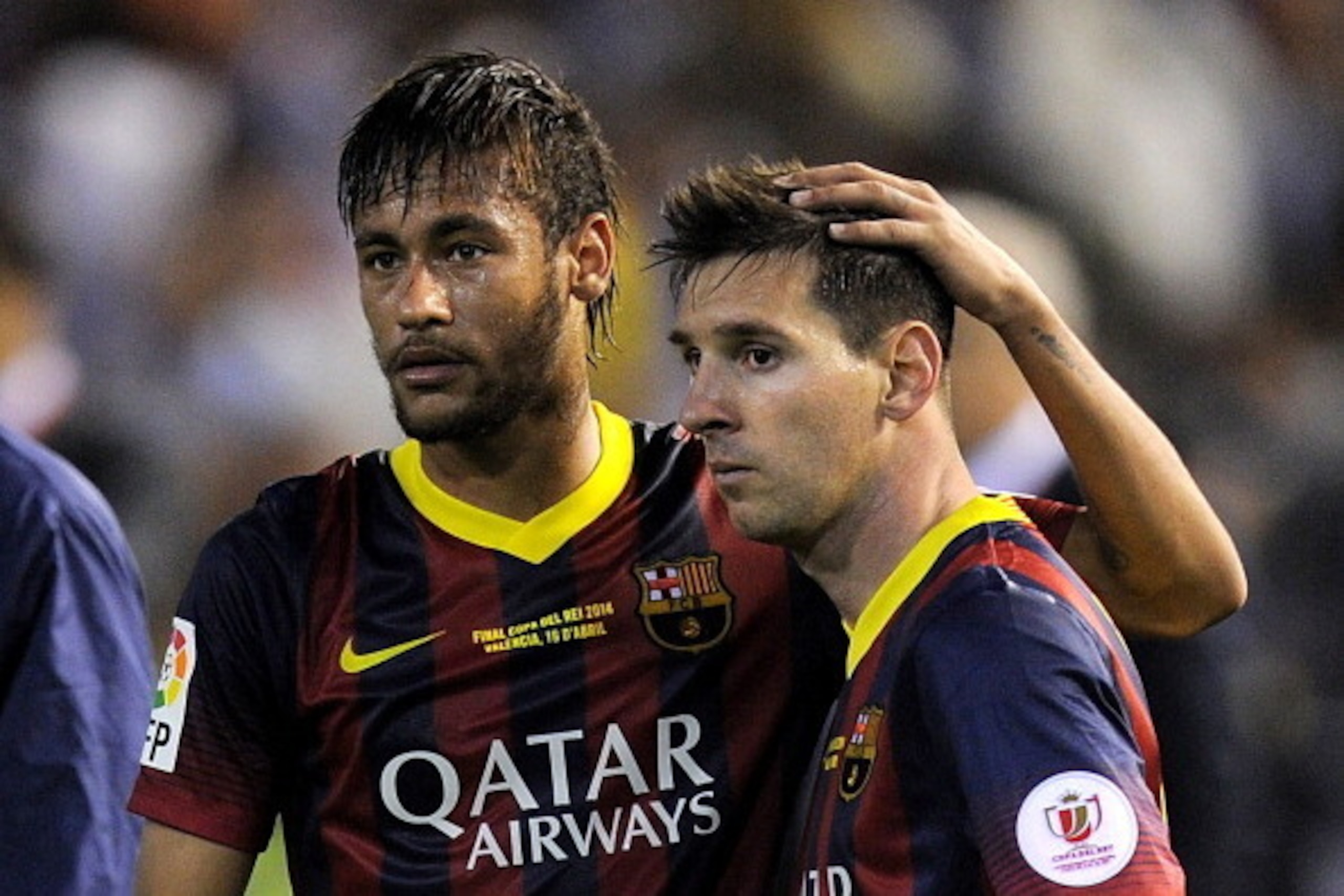 VALENCIA, SPAIN - APRIL 16:  Lionel Messi (R) and Neymar of FC Barcelona react after losing 2-1 to Real Madrid in the Copa del Rey Final between Real Madrid and Barcelona at Estadio Mestalla on April 16, 2014 in Valencia, Spain.  (Photo by Denis Doyle/Get