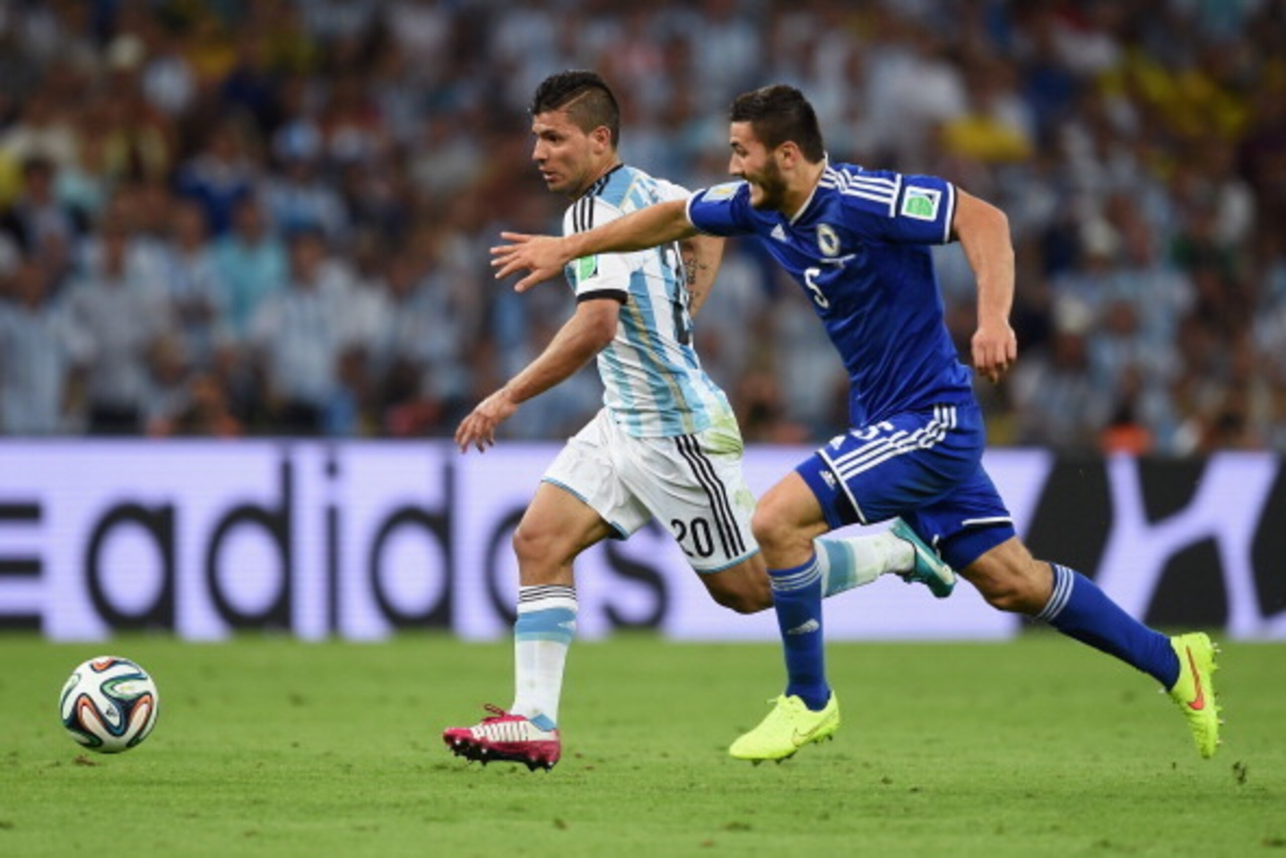 RIO DE JANEIRO, BRAZIL - JUNE 15: Sergio Aguero of Argentina controls the ball against Sead Kolasinac of Bosnia and Herzegovina during the 2014 FIFA World Cup Brazil Group F match between Argentina and Bosnia-Herzegovina at Maracana on June 15, 2014 in Ri