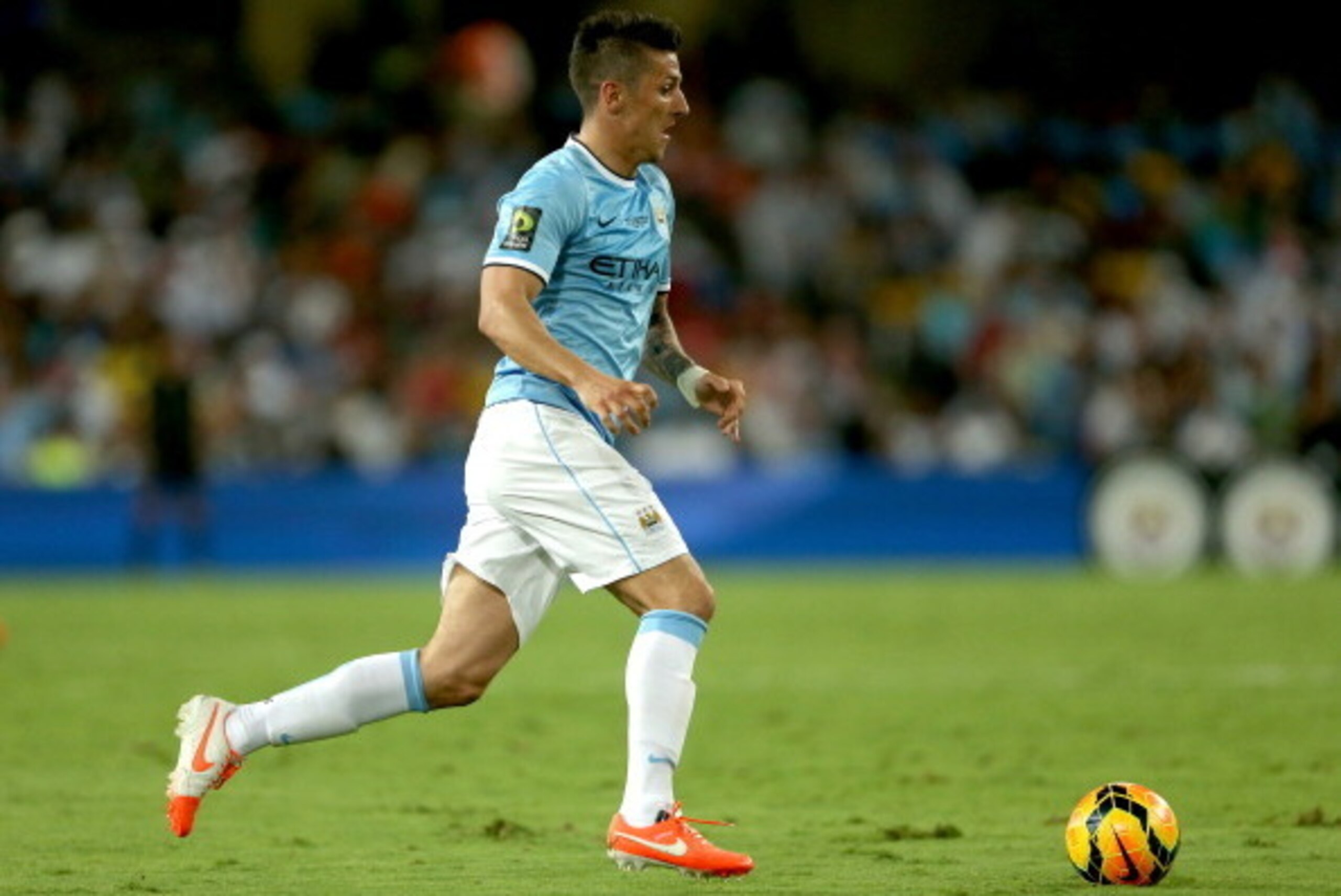 AL AIN, UNITED ARAB EMIRATES - MAY 15:  Stevan Jovetic of Manchester City in action during the friendly match between Al Ain and Manchester City at Hazza bin Zayed Stadium on May 15, 2014 in Al Ain, United Arab Emirates.  (Photo by Warren Little/Getty Ima