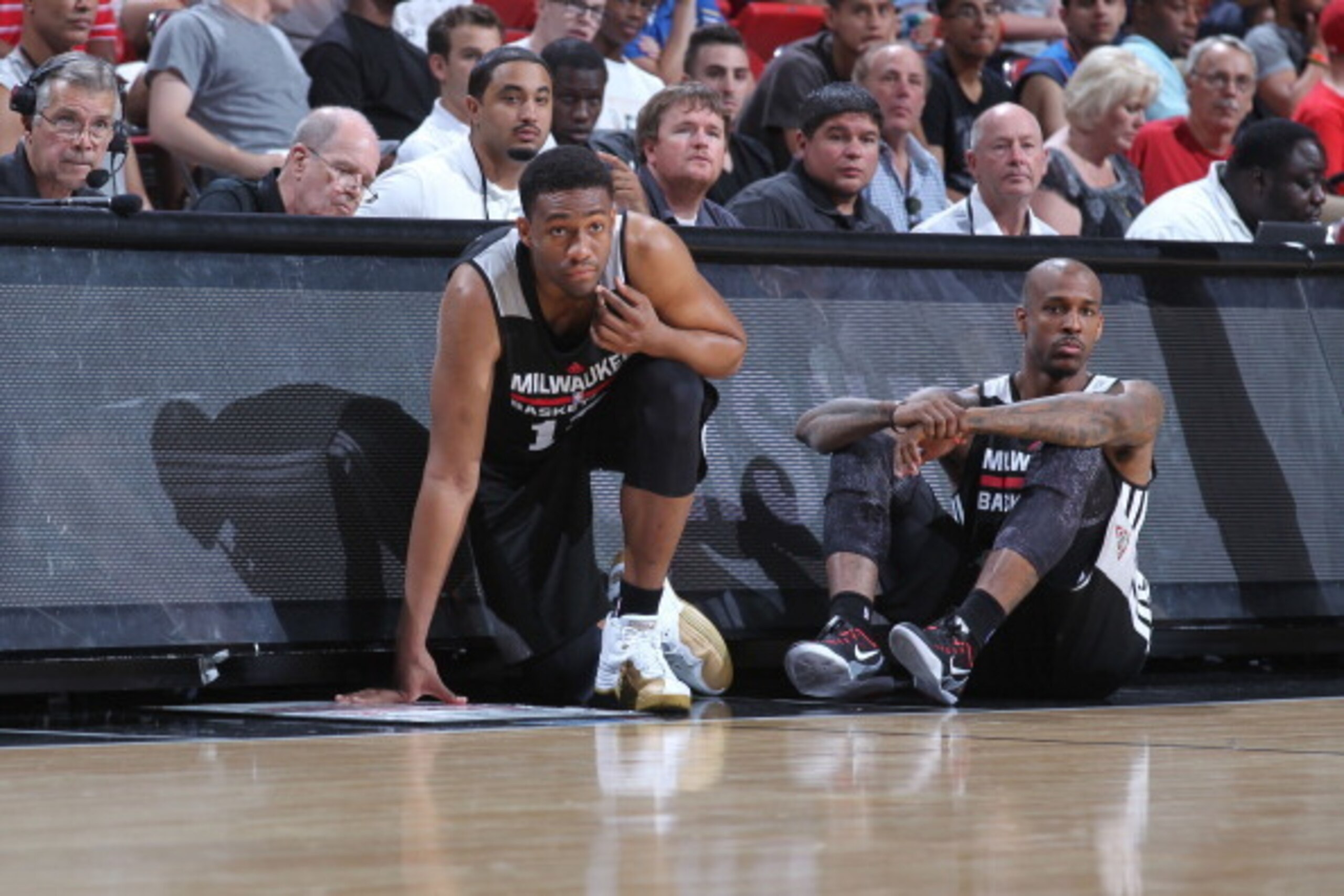 LAS VEGAS, NV - JULY 16: Jabari Parker #12 and Gilbert Brown #5 of the Milwaukee Bucks wait to check into the game against the San Antonio Spurs at the Samsung NBA Summer League 2014 on July 16, 2014 at the Thomas & Mack Center in Las Vegas, Nevada. NOTE 