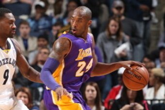 MEMPHIS, TN - DECEMBER 17: Kobe Bryant #24 of the Los Angeles Lakers controls the ball against the Memphis Grizzlies on December 17, 2013 at FedExForum in Memphis, Tennessee. NOTE TO USER: User expressly acknowledges and agrees that, by downloading and or